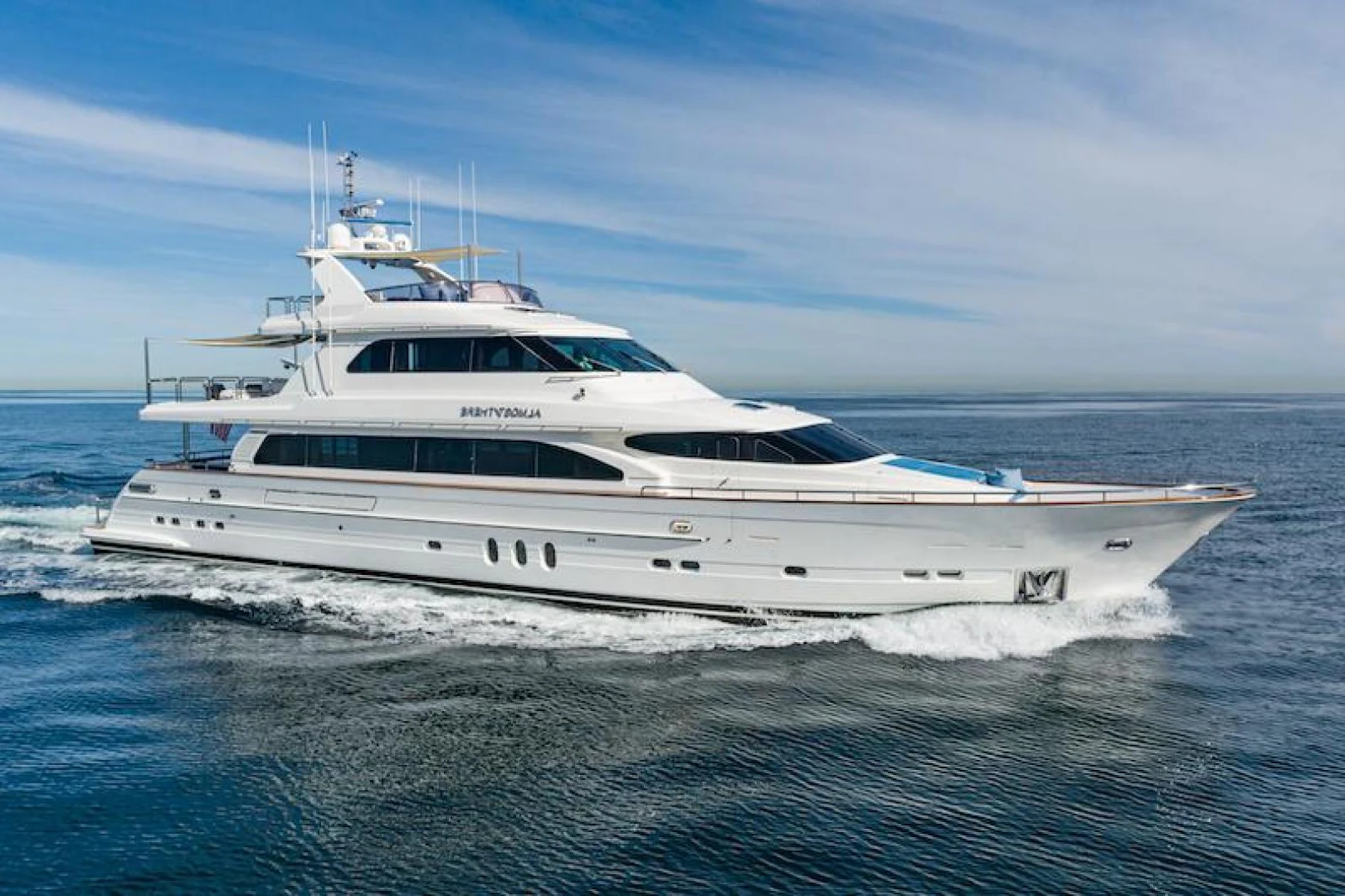 a white yacht in the water aboard ALMOST THERE Yacht for Sale
