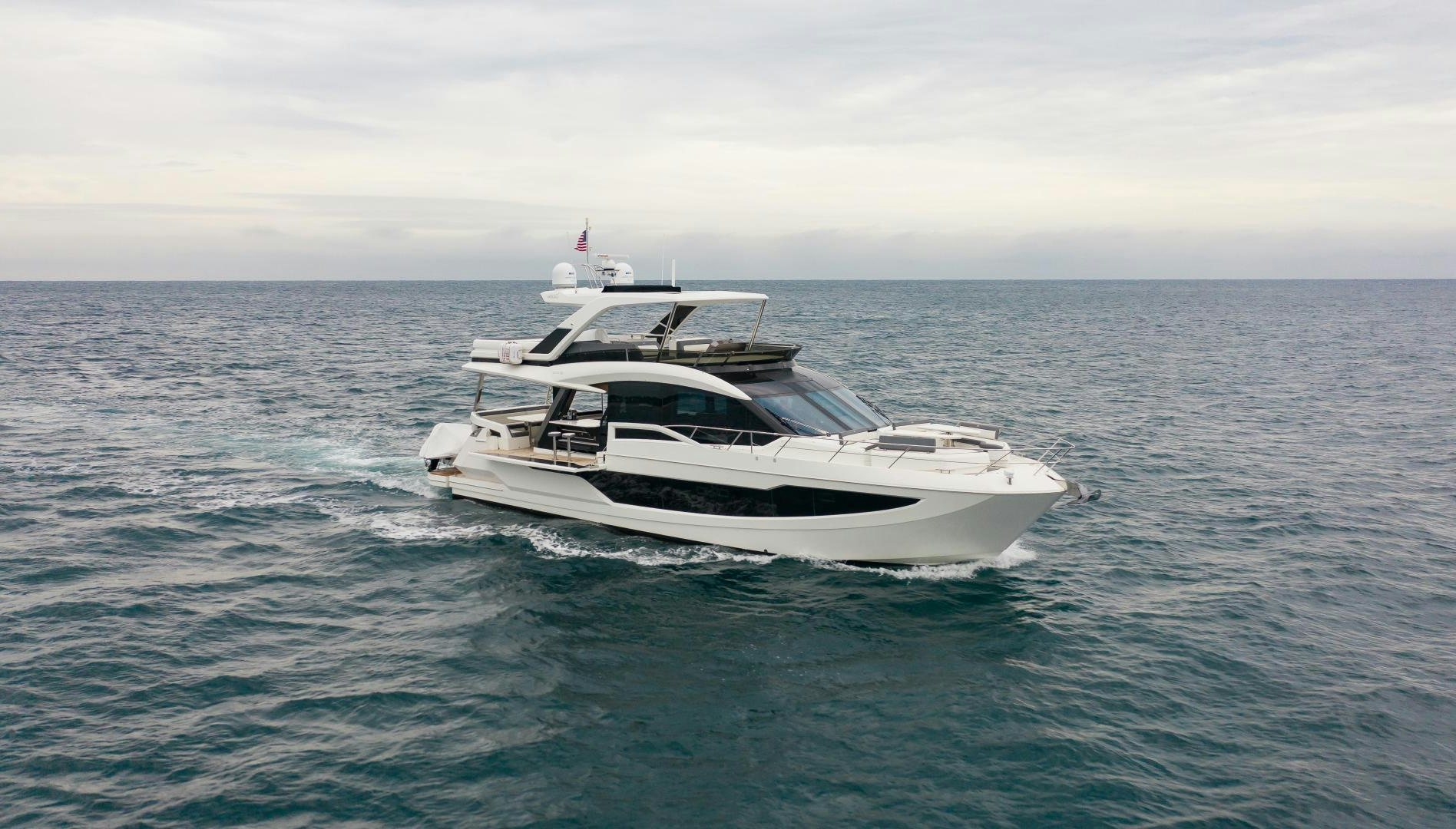a white boat in the water aboard LYLA BEE Yacht for Sale