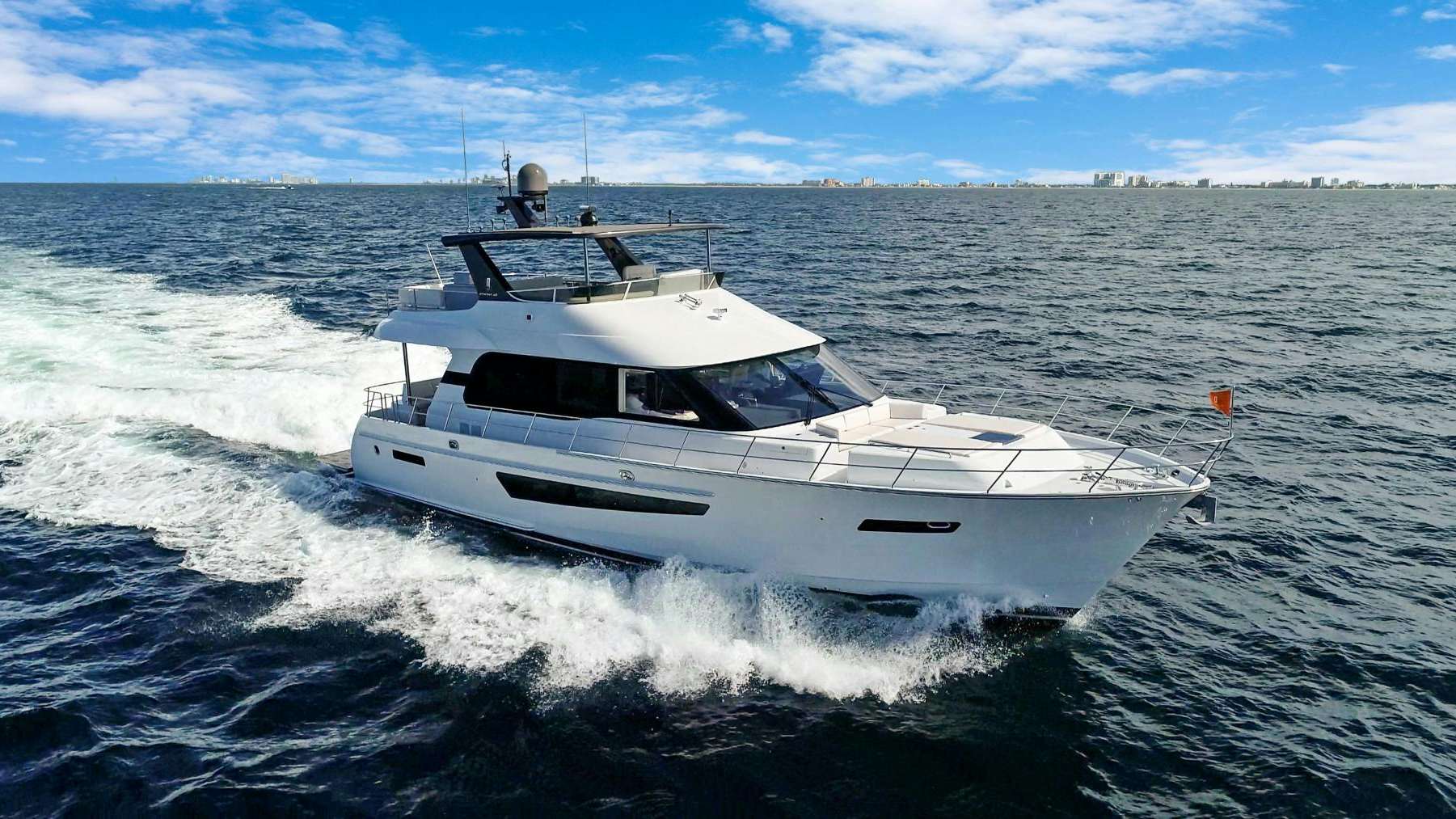 a white yacht on the water aboard CLB65 Yacht for Sale