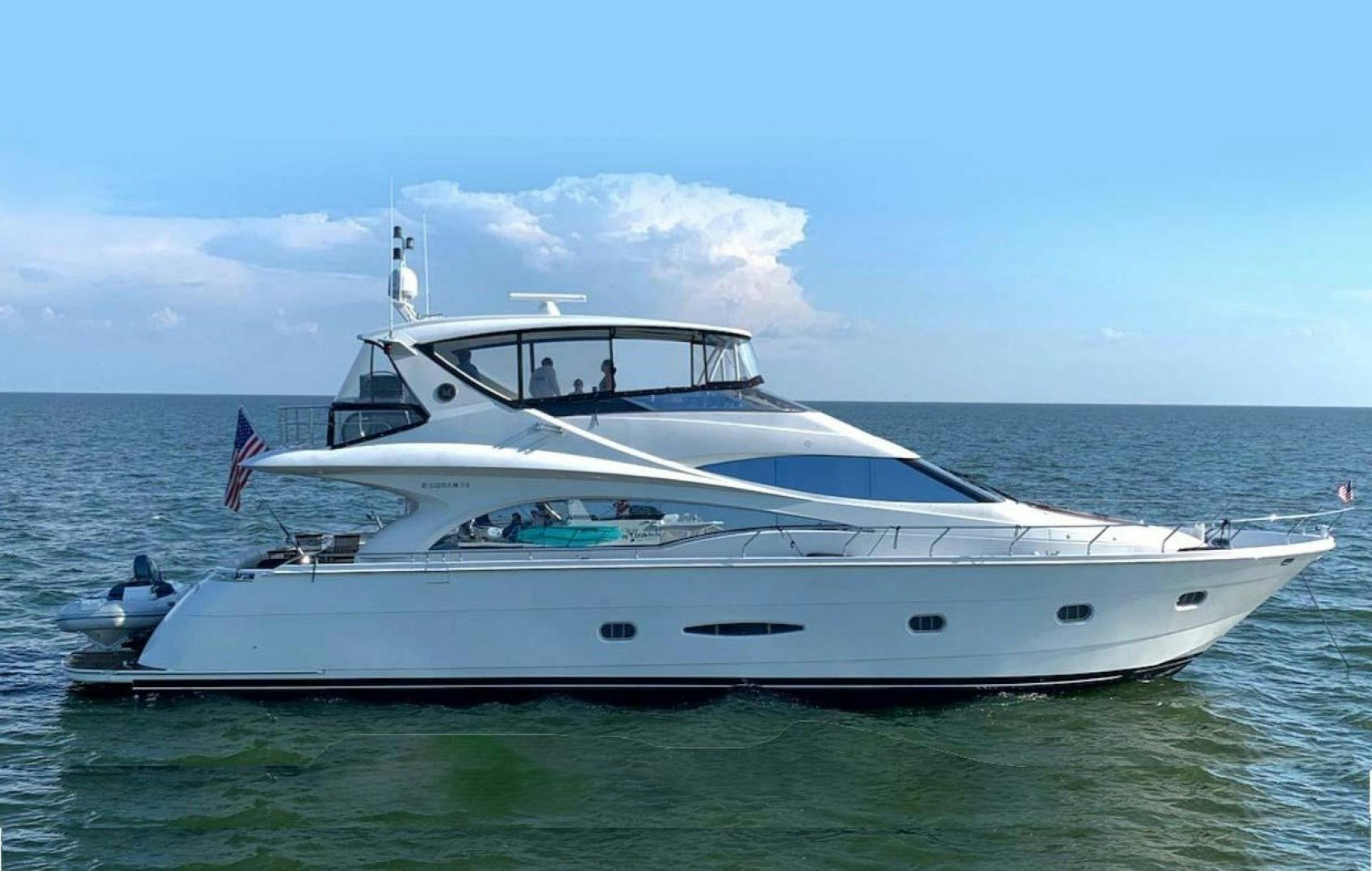 a white yacht in the water aboard DECKED OUT Yacht for Sale