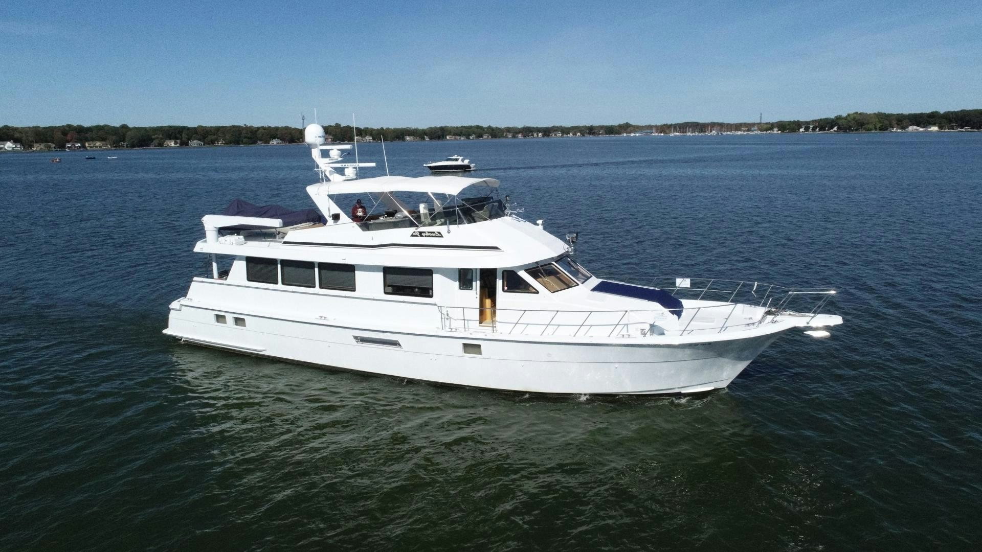 a white yacht on the water aboard LUCKY JOE Yacht for Sale