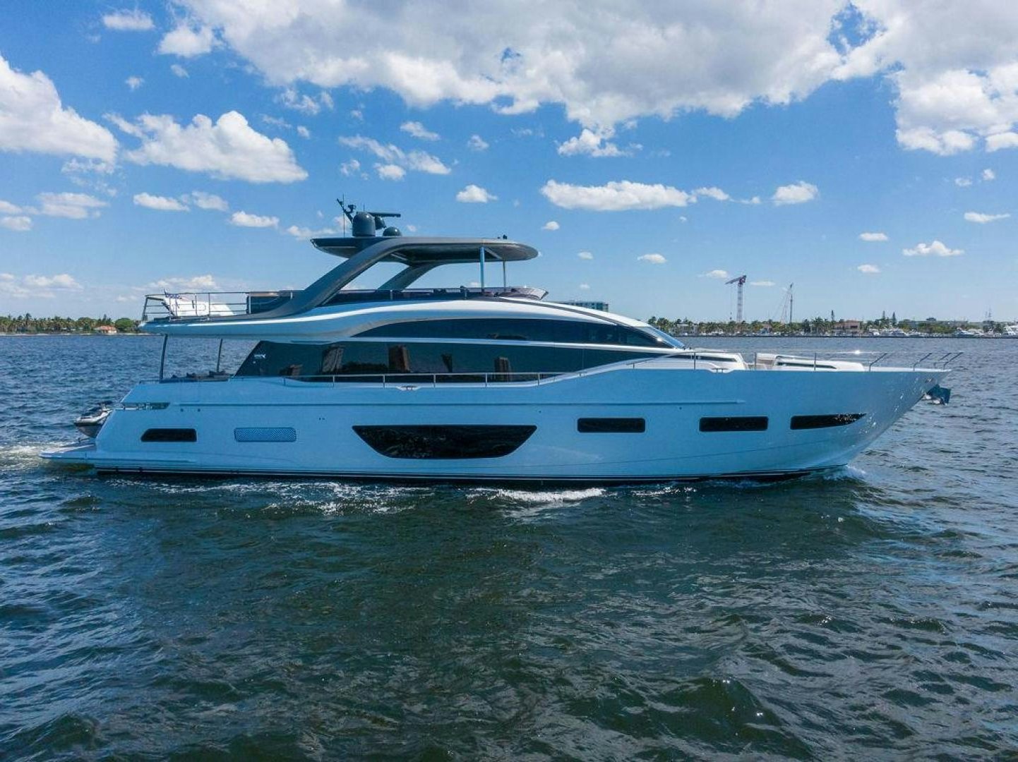 a white boat in the water aboard EMPIRE SUN Yacht for Sale