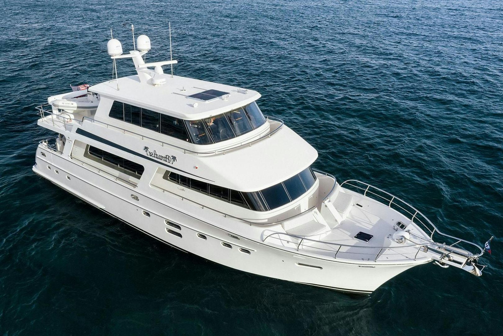 a white yacht in the water aboard PARADISE Yacht for Sale