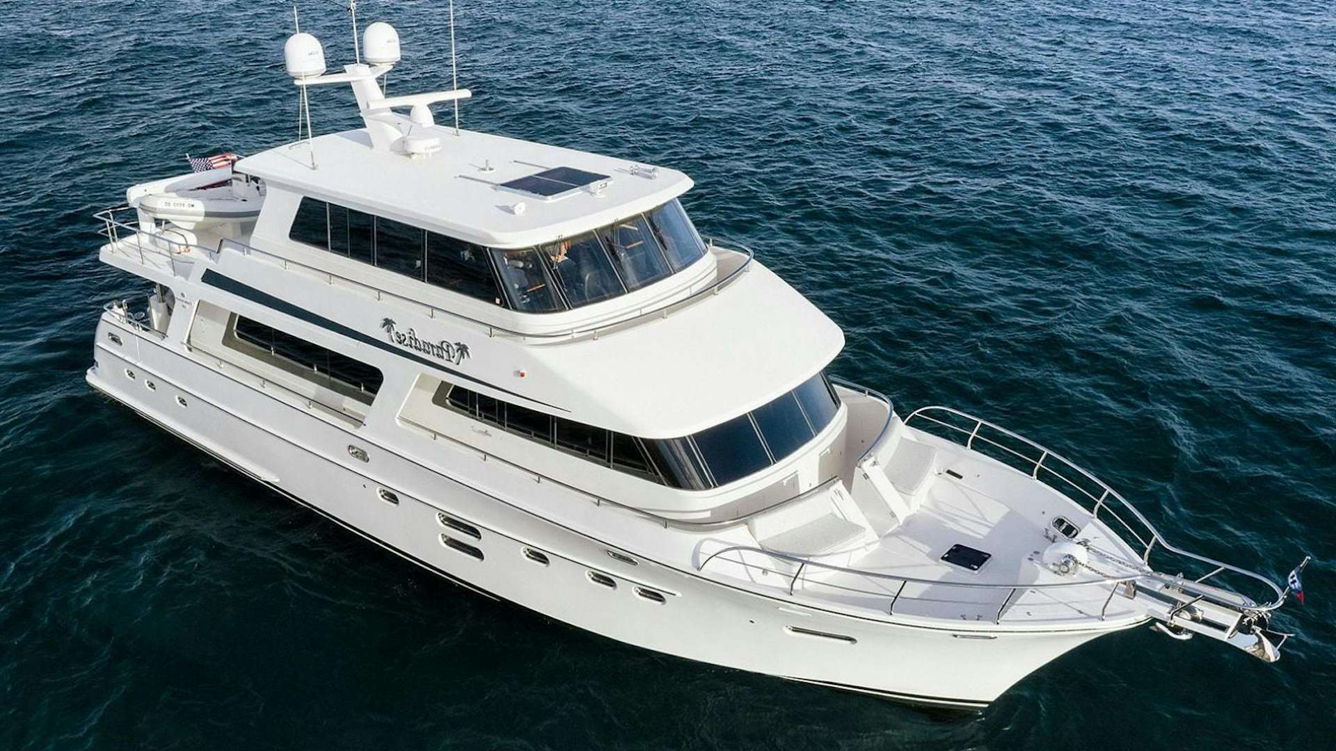 a white yacht in the water aboard PARADISE Yacht for Sale