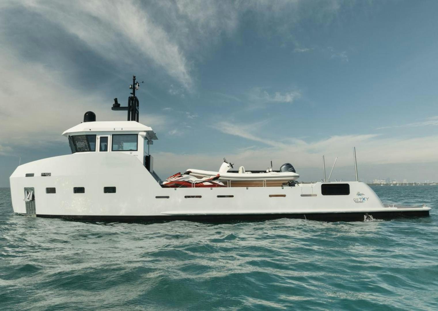 a white boat in the water aboard NANAN SHADOW Yacht for Sale