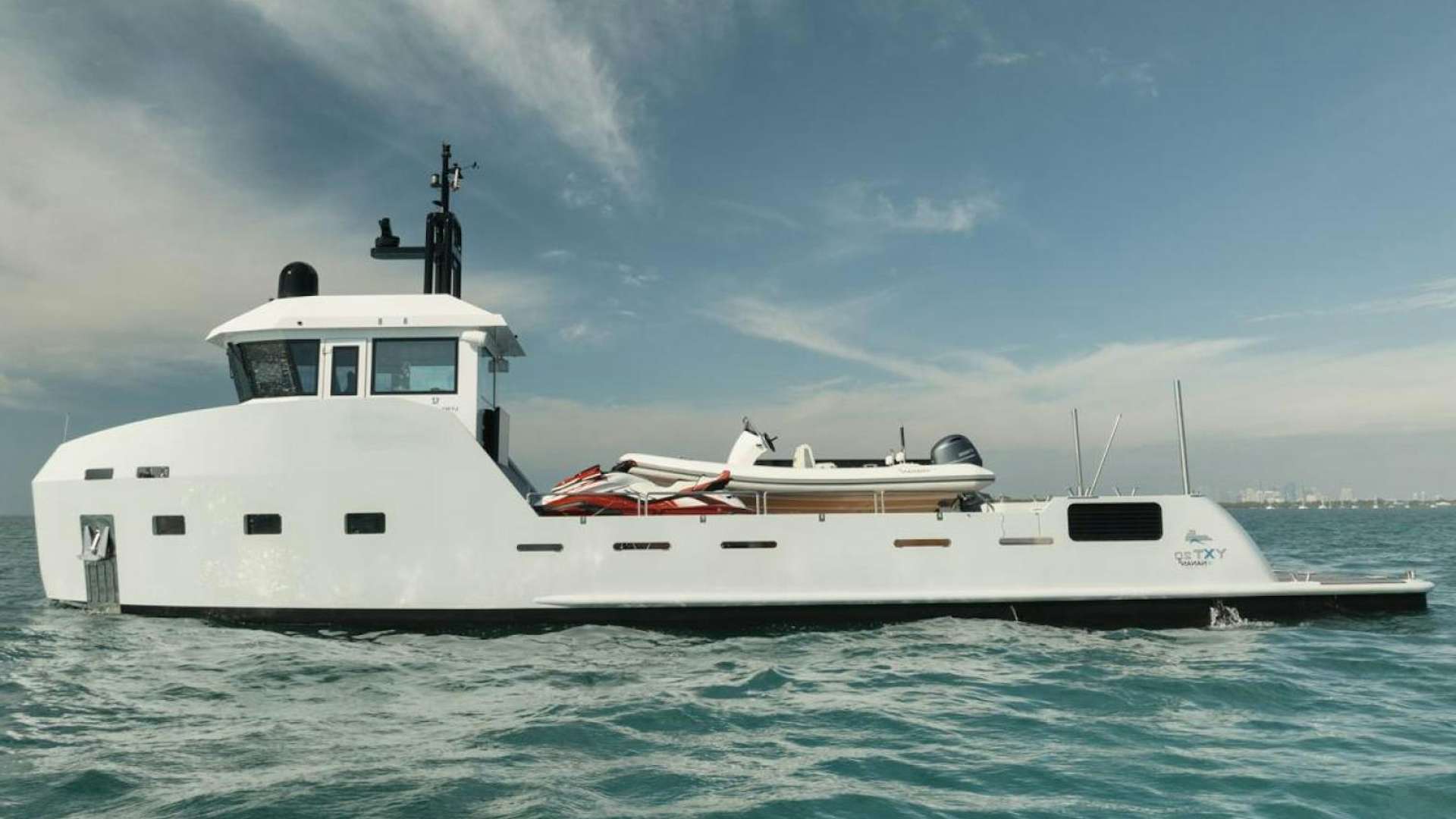 a white boat in the water aboard NANAN SHADOW Yacht for Sale