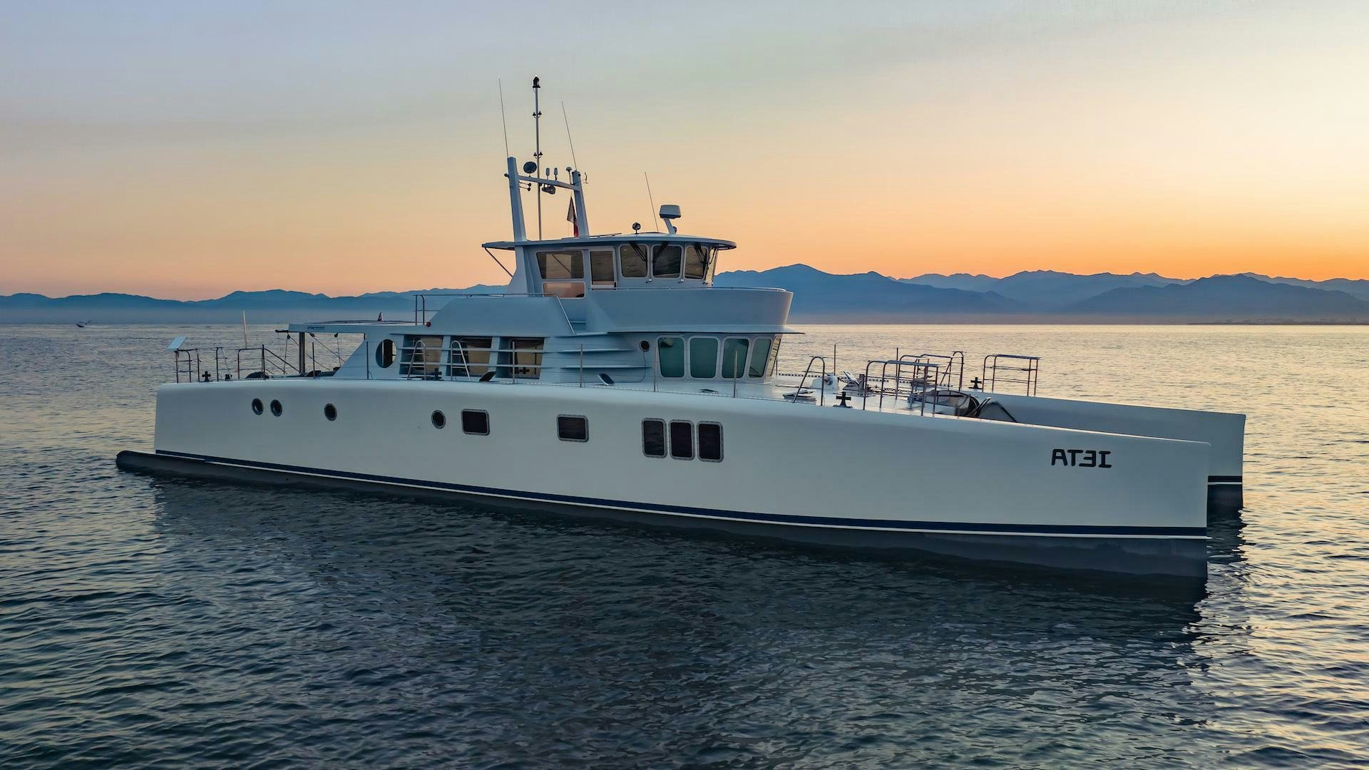 a large white boat in the water aboard IETA Yacht for Sale