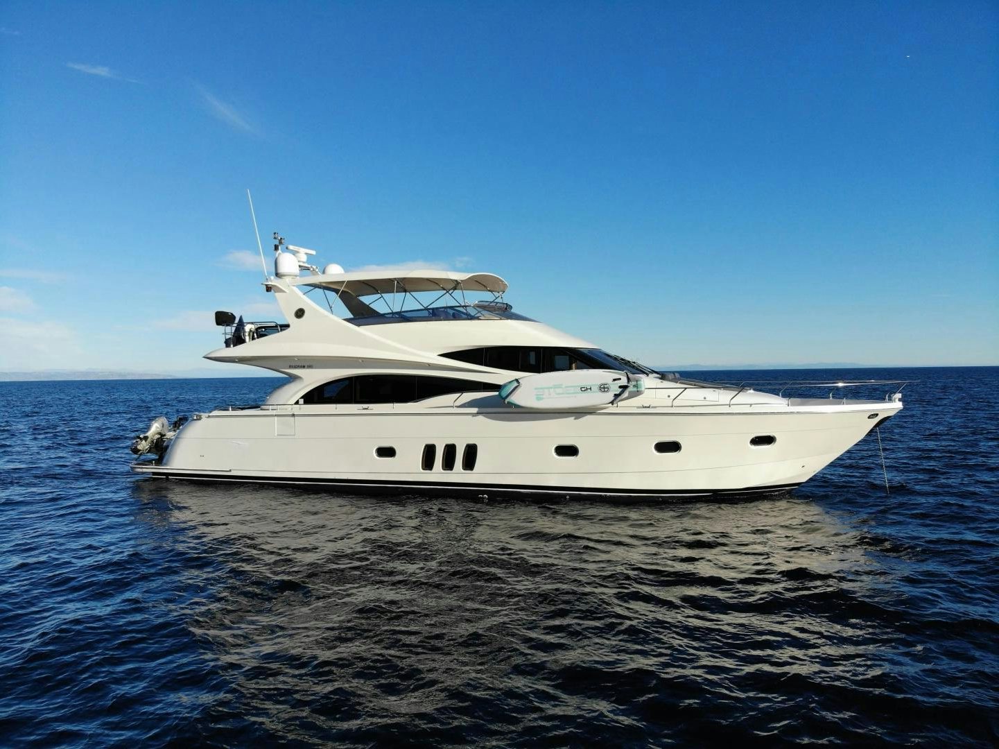 a white yacht on the water aboard STARTING OVER Yacht for Sale