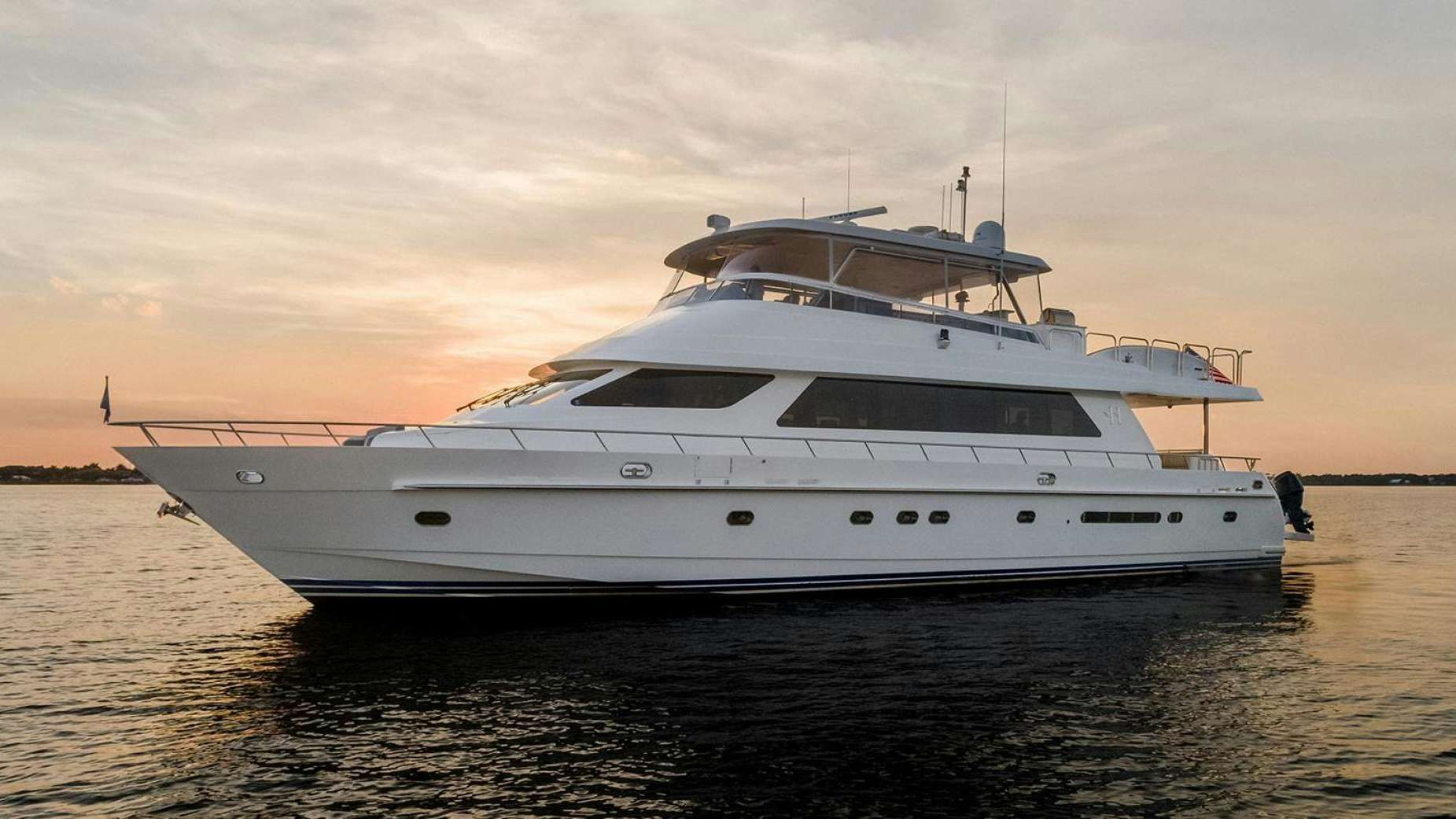 a white yacht on the water aboard DARK HORSE Yacht for Sale