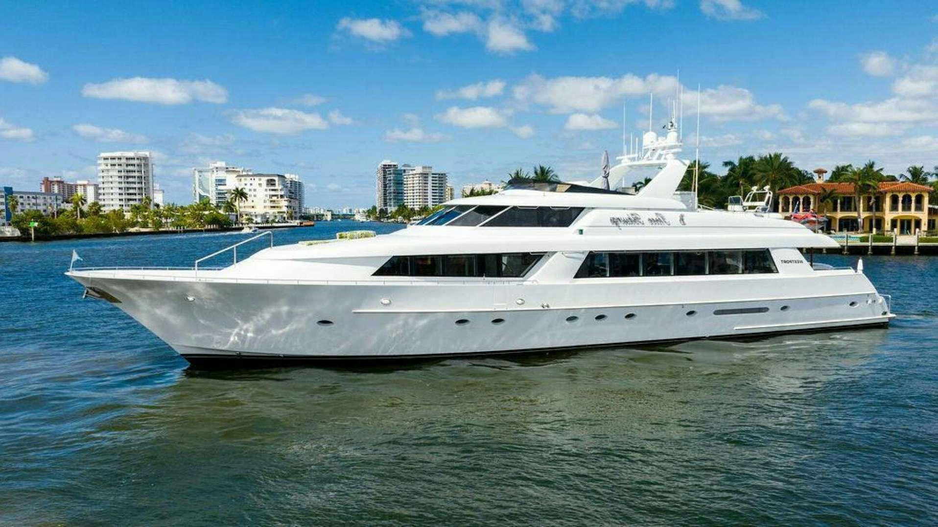 a white yacht in the water aboard THREE BLESSINGS Yacht for Sale