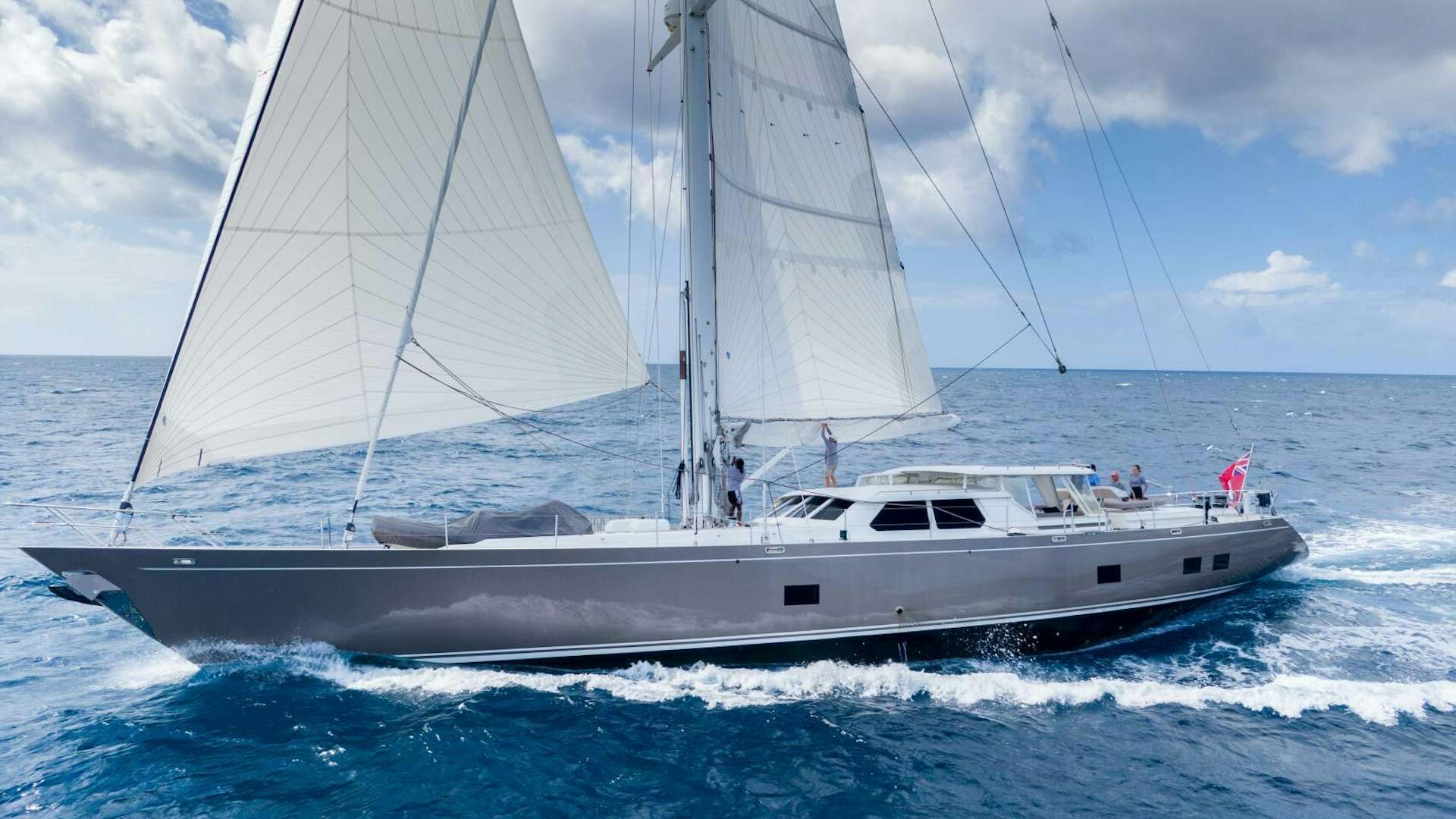 a white boat on the water aboard VAGABOND Yacht for Sale