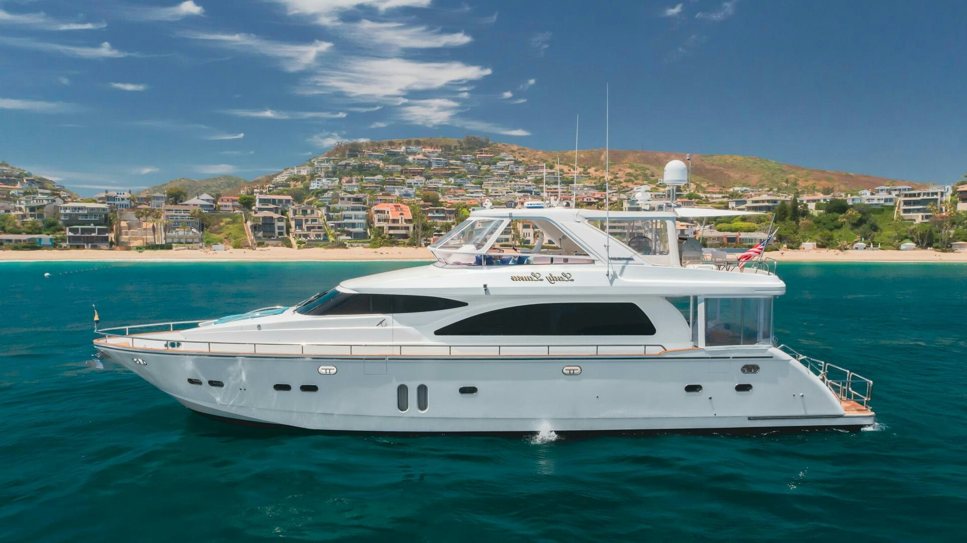 a white yacht in the water aboard LADY LAURA Yacht for Sale
