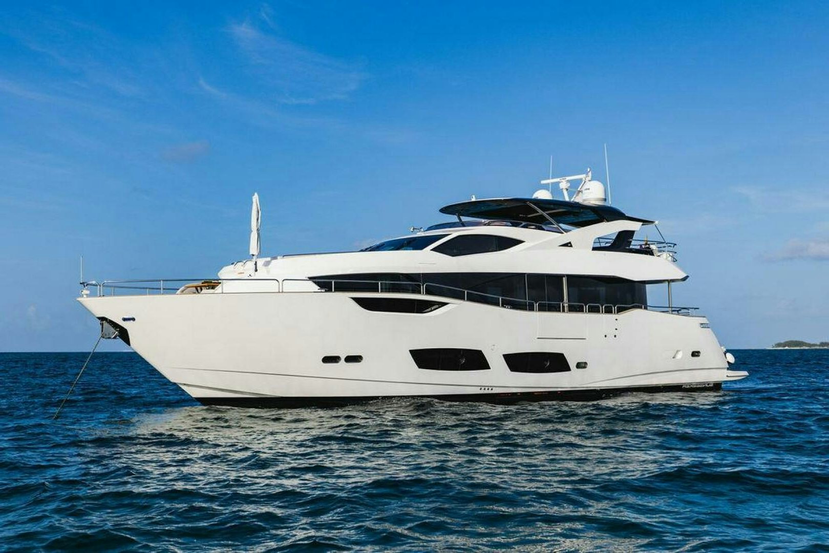 a white yacht on the water aboard PURA VIDA Yacht for Sale