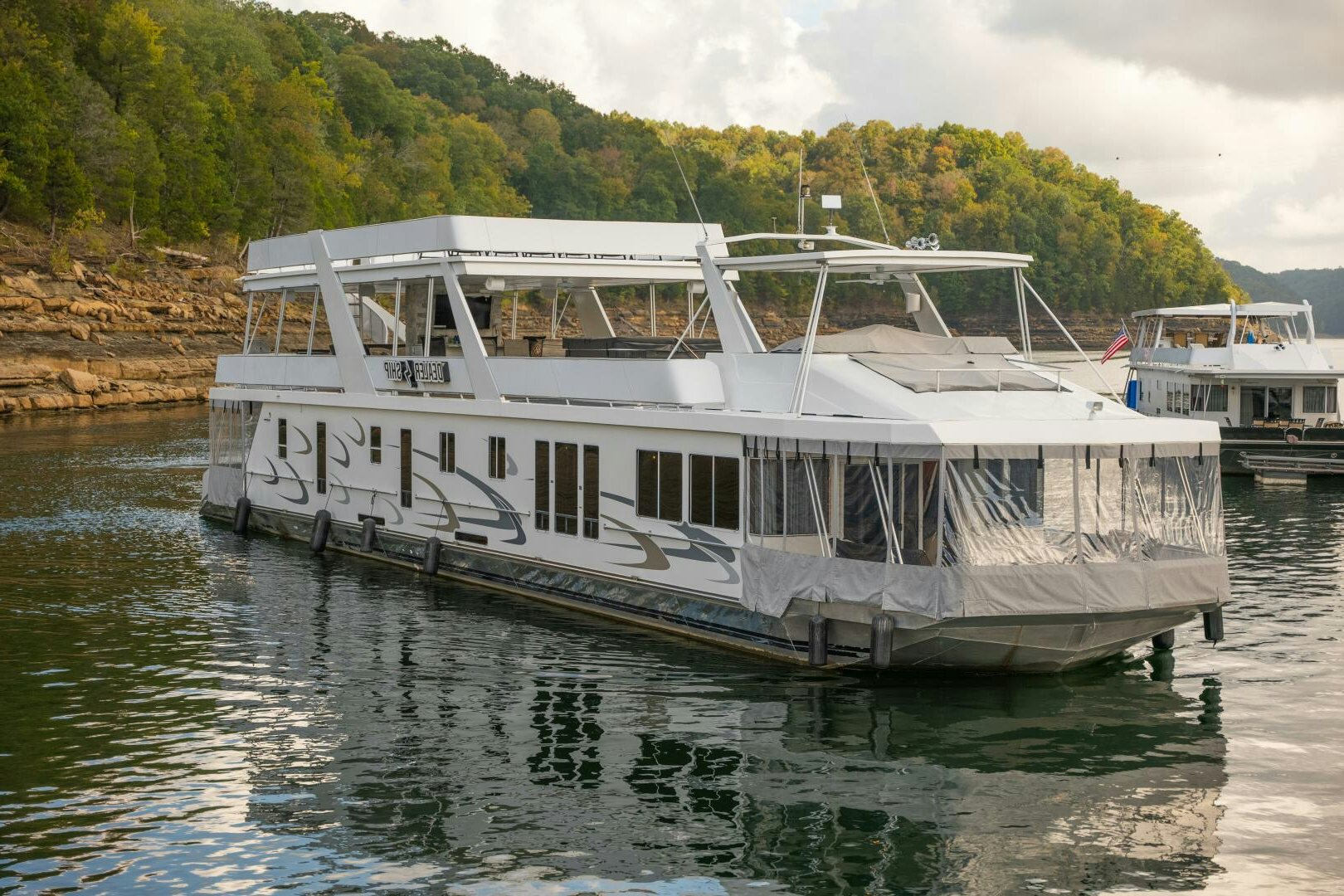 a white boat on the water aboard SUNSTAR Yacht for Sale