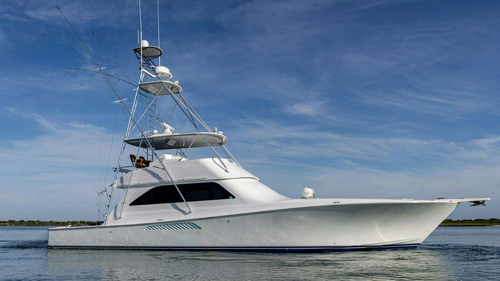 a white yacht on the water aboard LO KEY Yacht for Sale