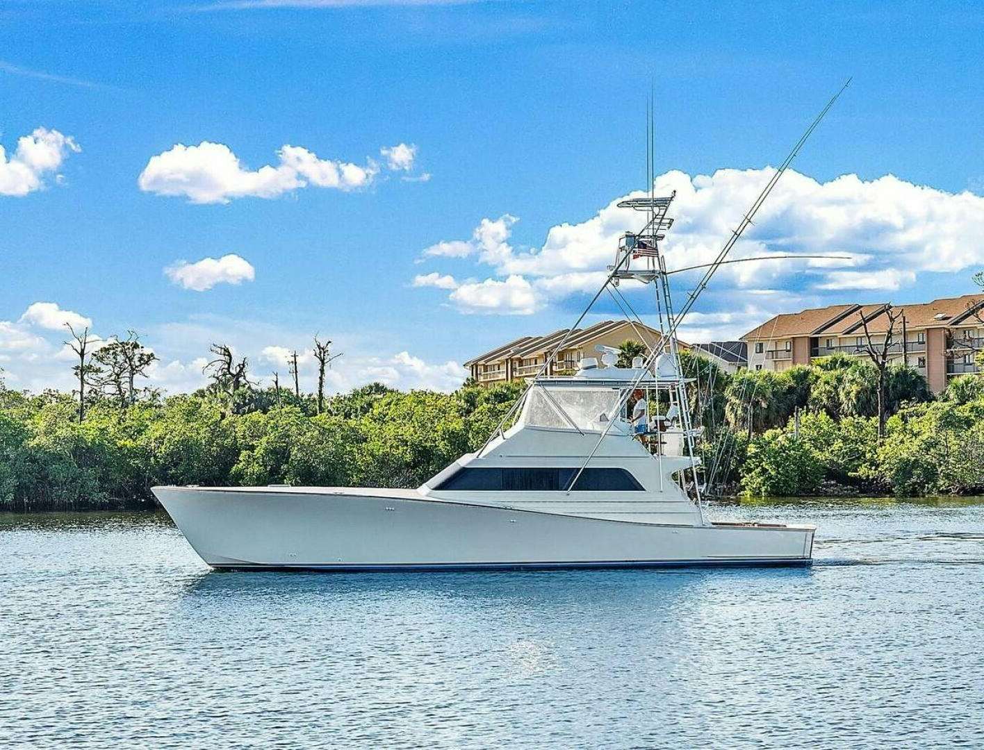 a white boat on the water aboard REEL DEVOCEAN Yacht for Sale