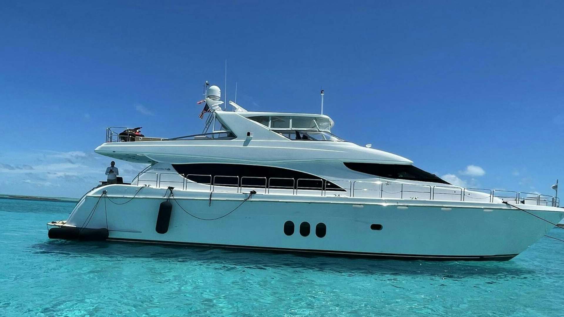a white yacht in the water aboard ARETECTE Yacht for Sale