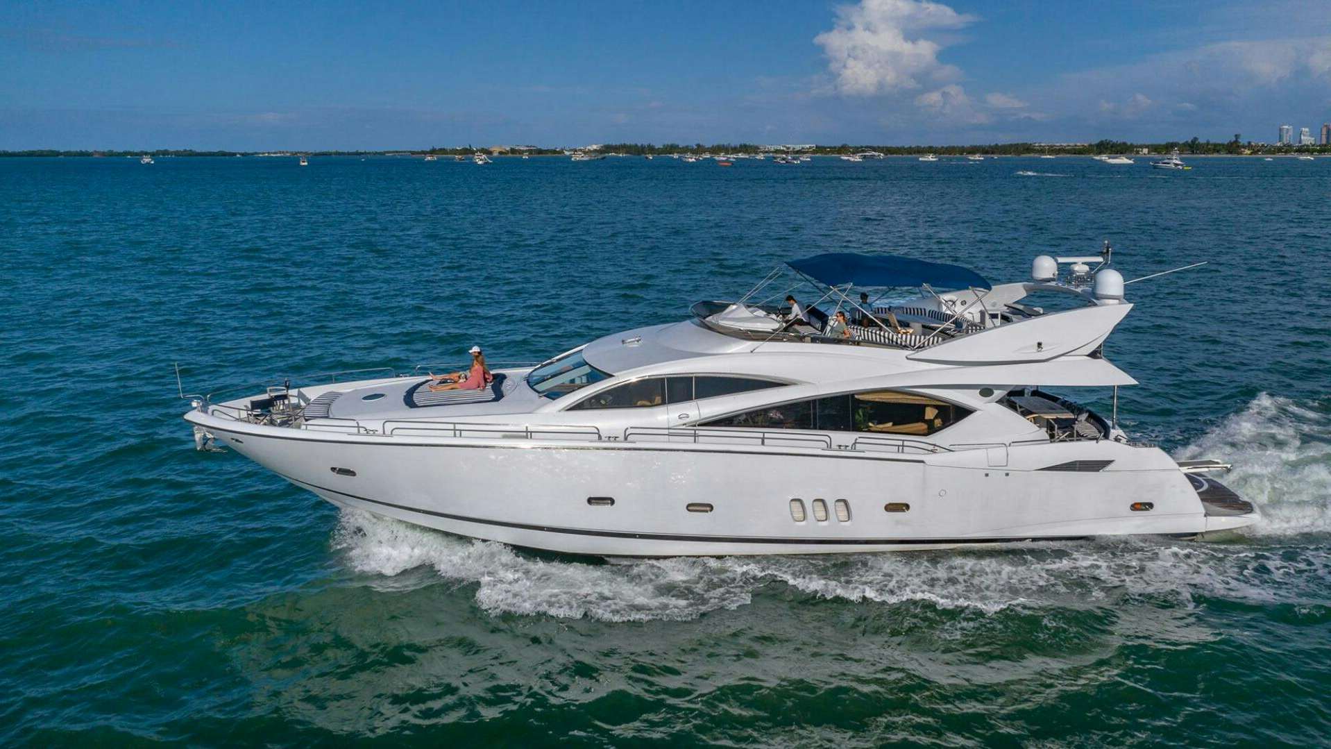 a white yacht in the water aboard ICONIC Yacht for Sale