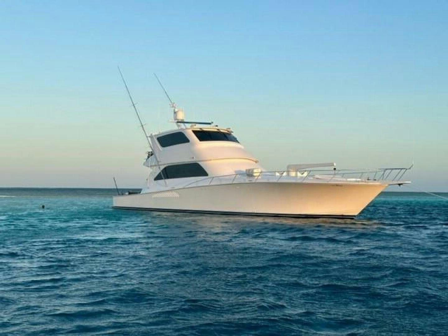 a white yacht in the water aboard 6 C Yacht for Sale