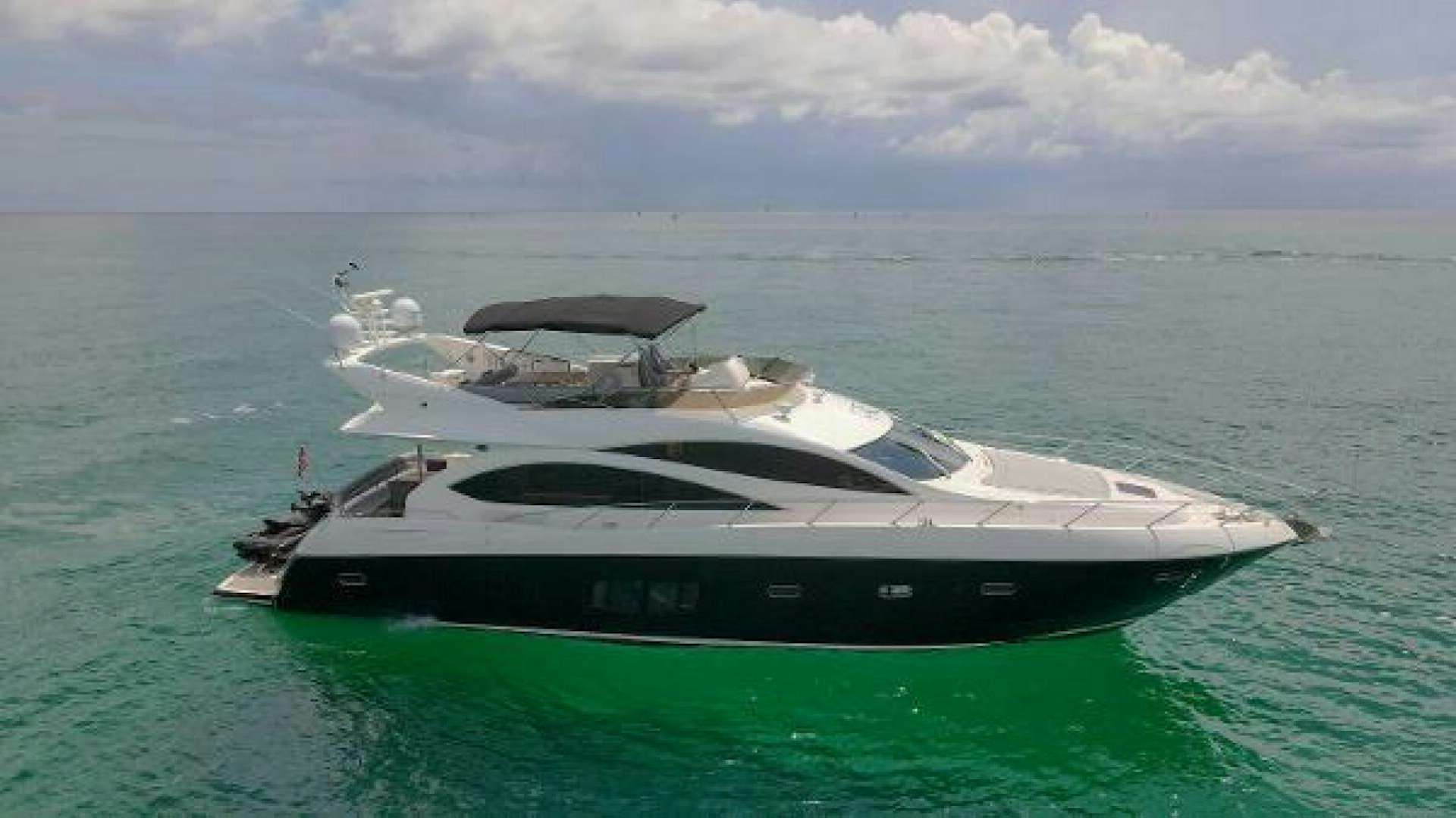a white yacht in the ocean aboard TWINS Yacht for Sale