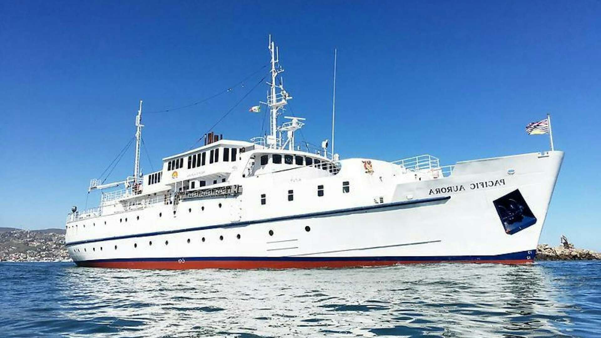 a large white ship in the water aboard SALTY Yacht for Sale