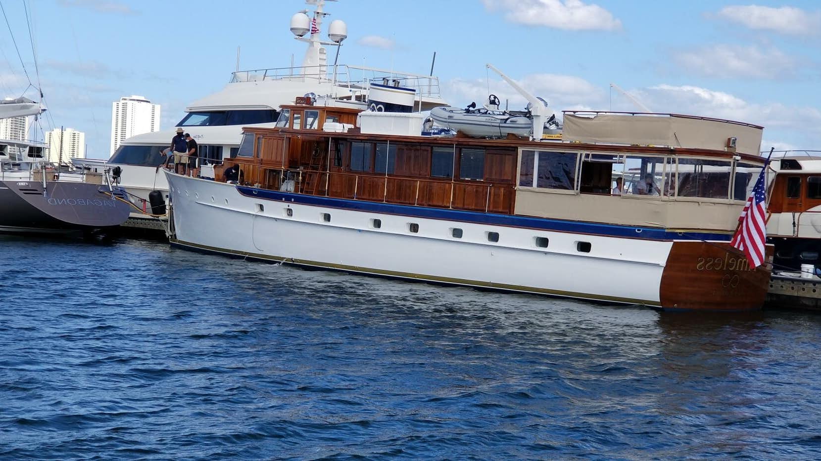 a large boat in the water aboard TIMELESS Yacht for Sale