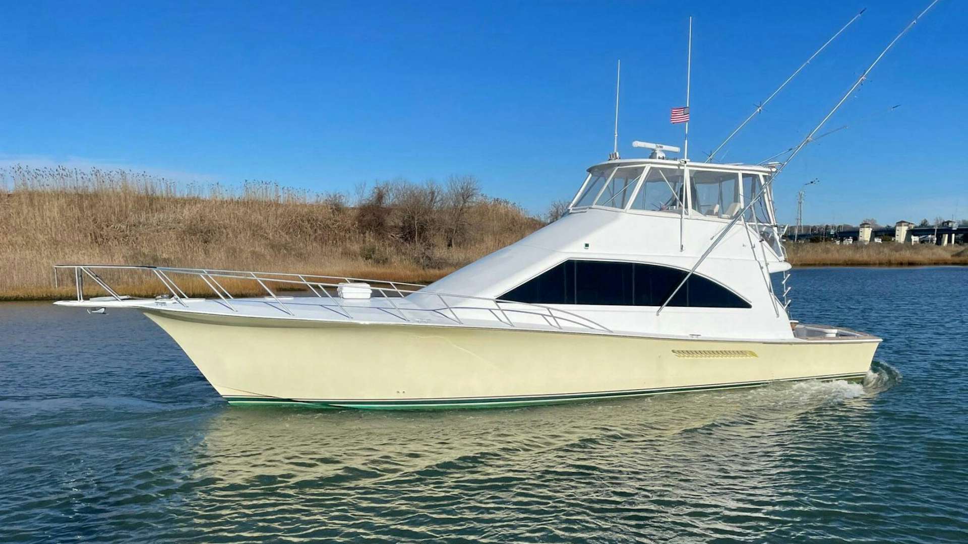 a white boat on water aboard END GAME Yacht for Sale
