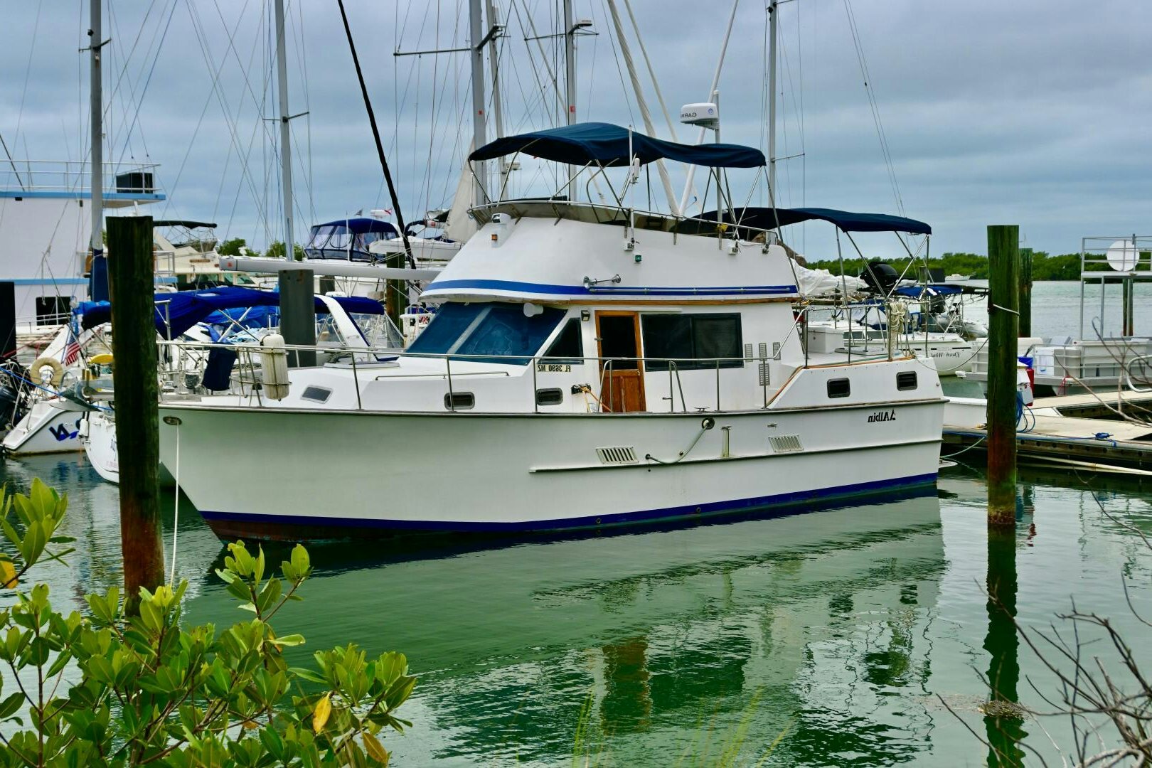 a boat docked at a pier aboard LITTLE BAYOU Yacht for Sale