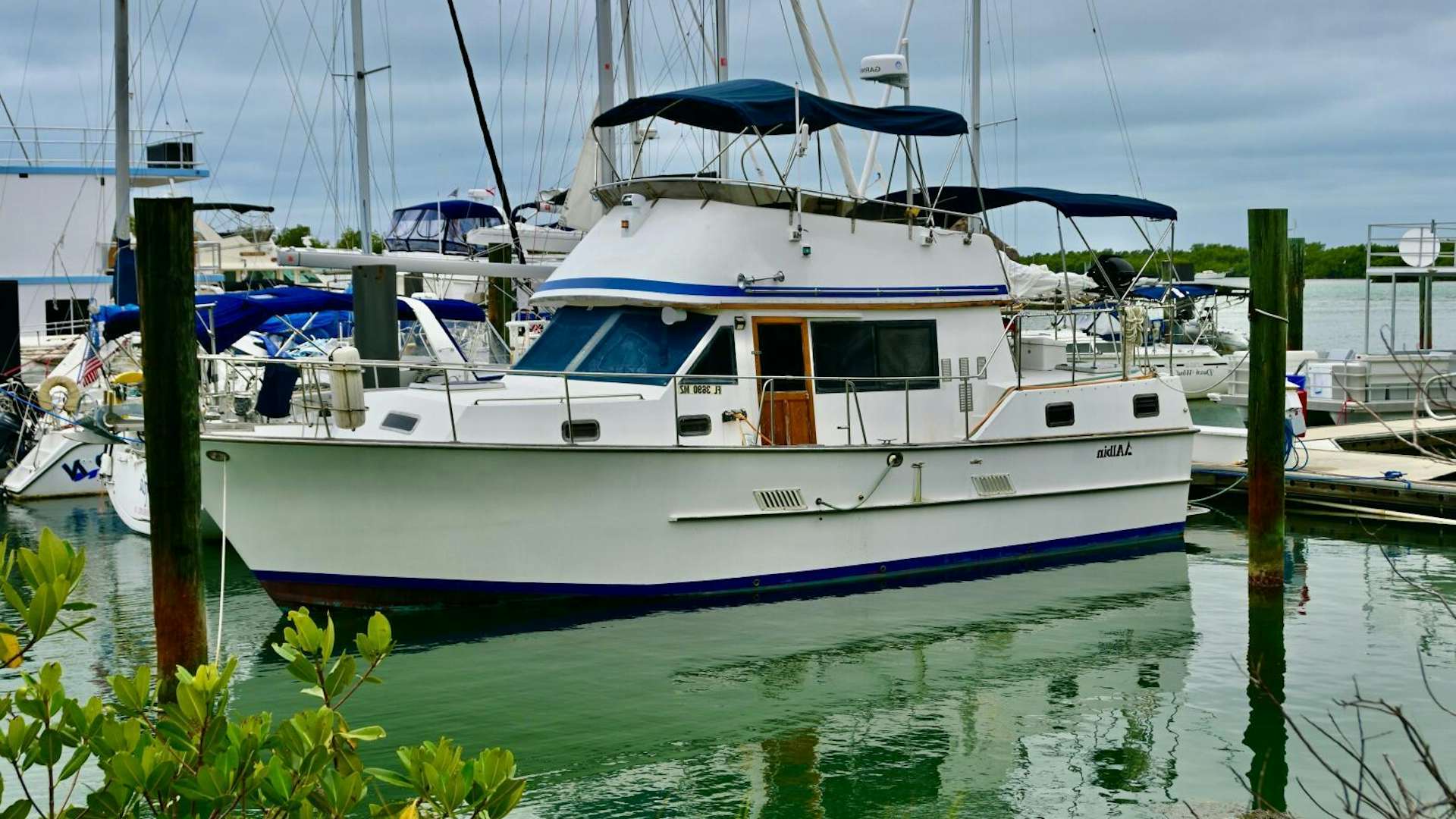 a boat docked at a pier aboard LITTLE BAYOU Yacht for Sale