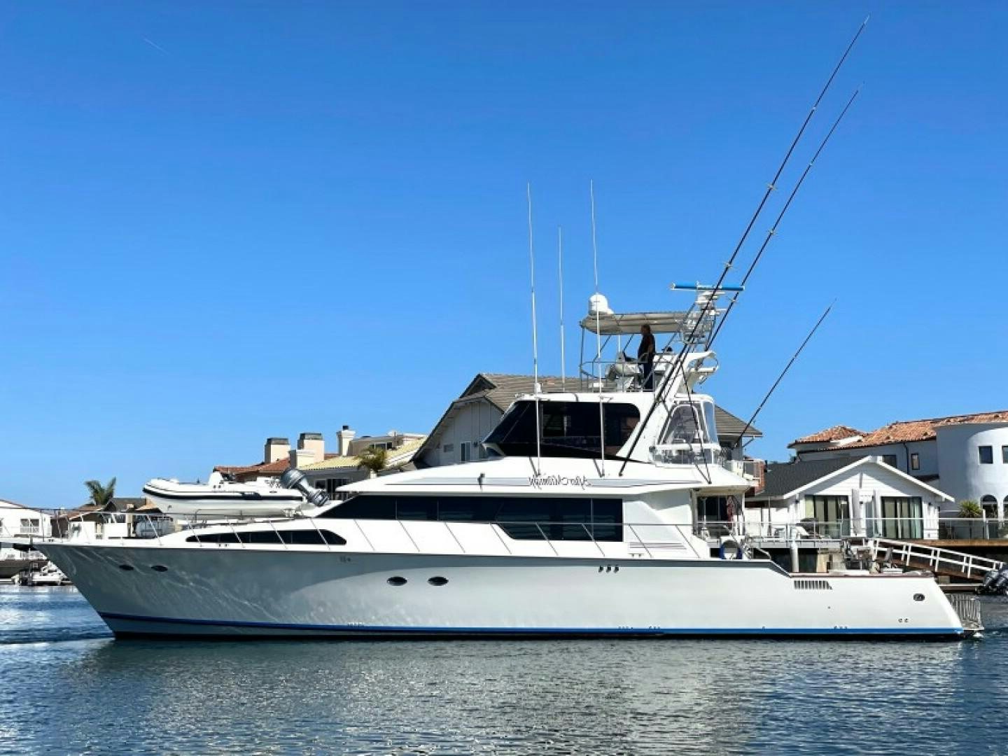 a white yacht in the water aboard AFTER MIDNIGHT Yacht for Sale