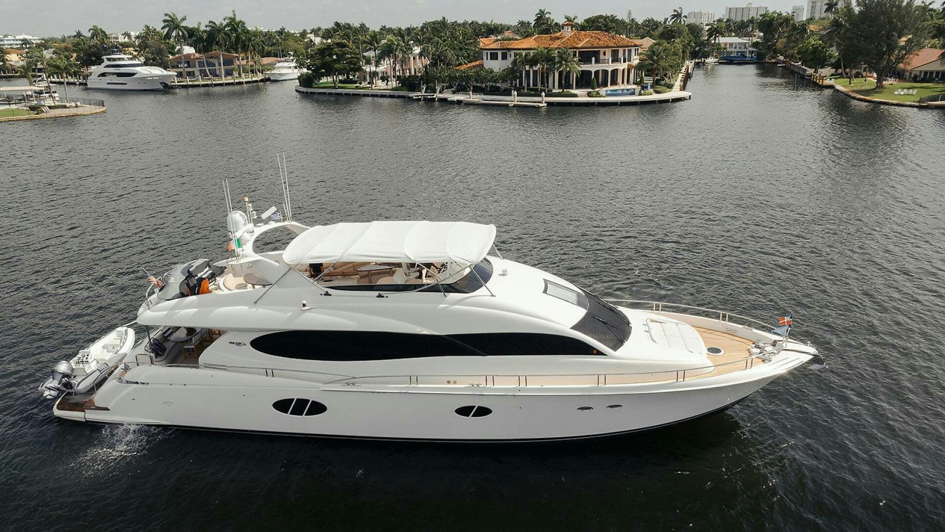 a white yacht in the water aboard 84 LAZZARA MOTOR YACHT / 2007 Yacht for Sale