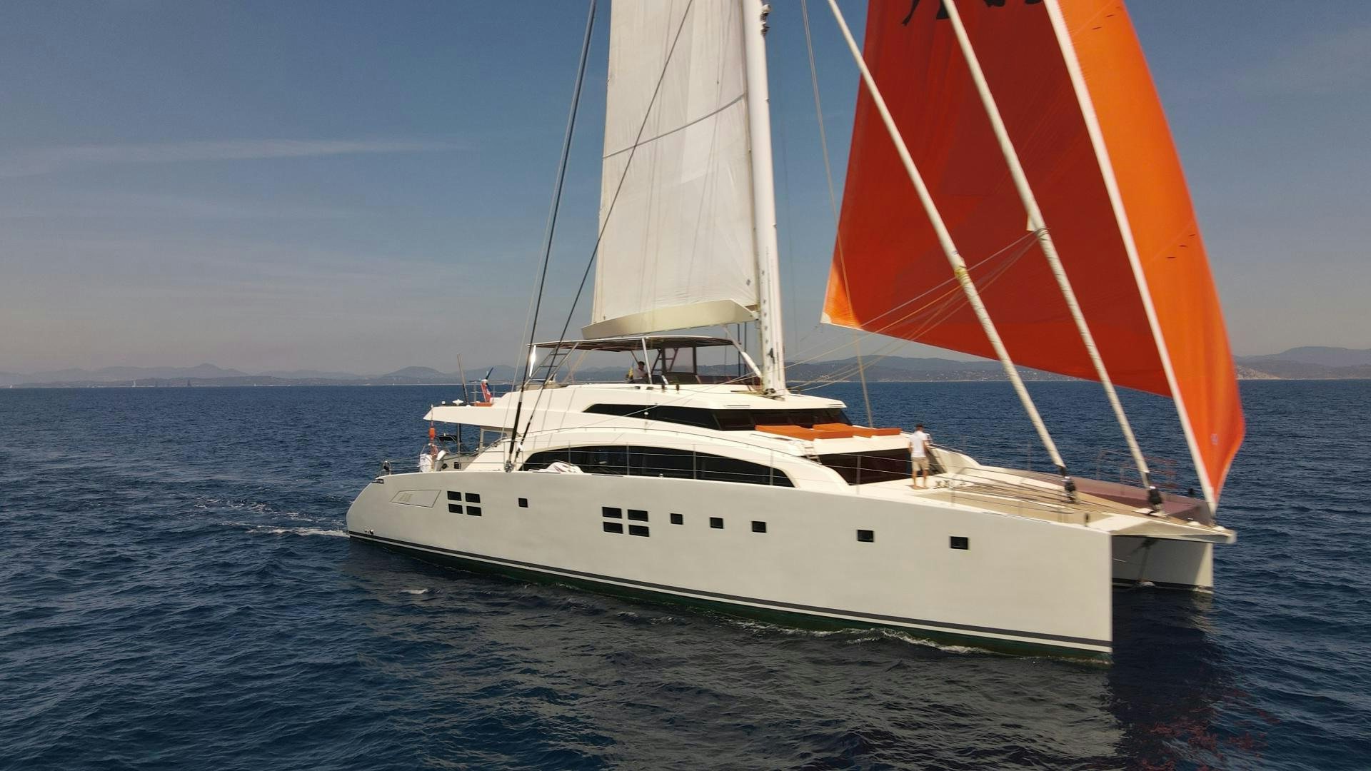 a white sailboat on the water aboard LITTLE GIANT Yacht for Sale