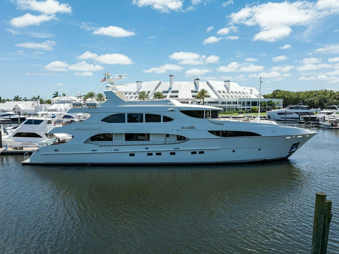 a large white yacht in a harbor aboard KIMBERLIE Yacht for Sale