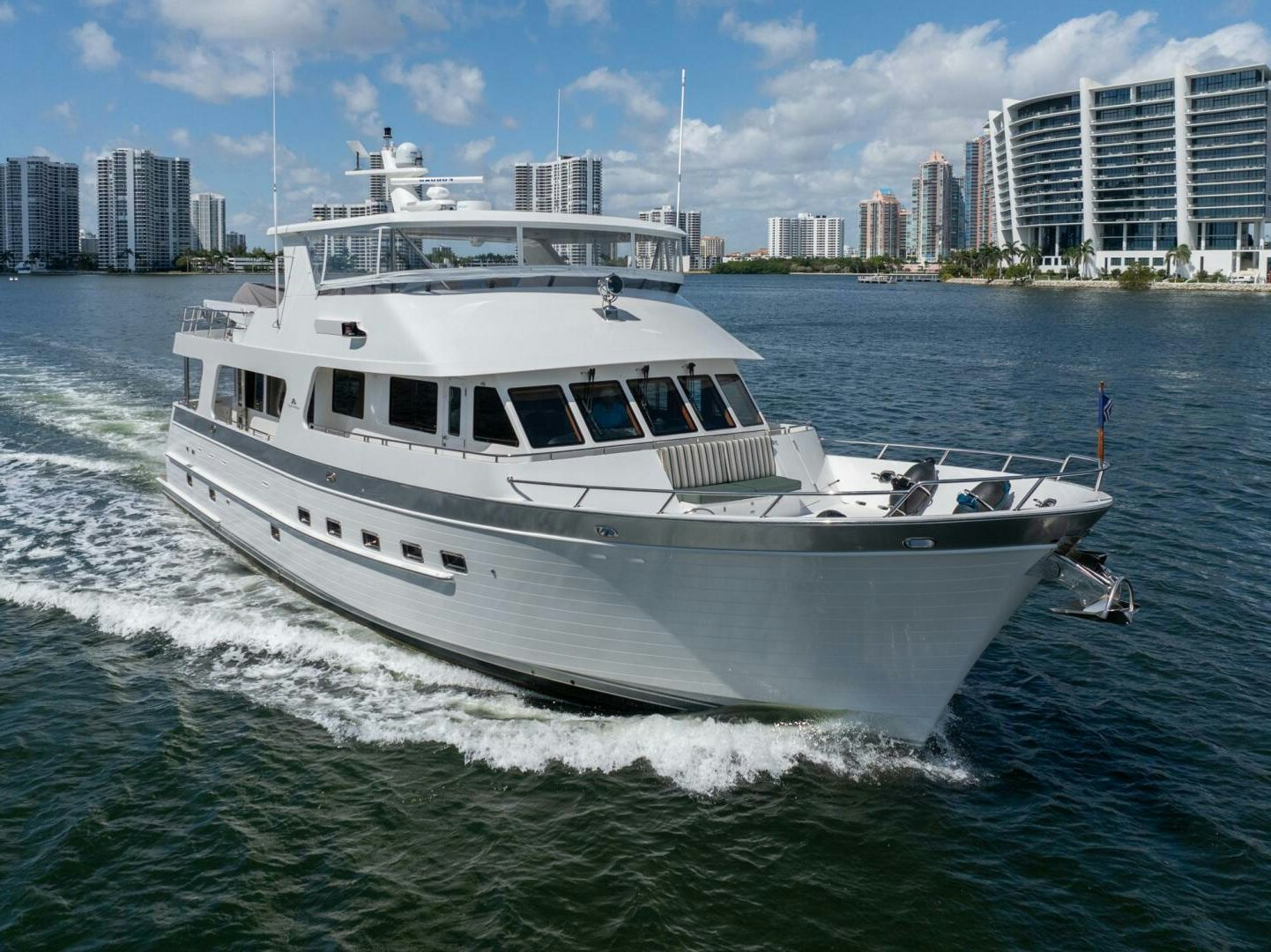 a white boat on the water aboard BAD-LAD Yacht for Sale