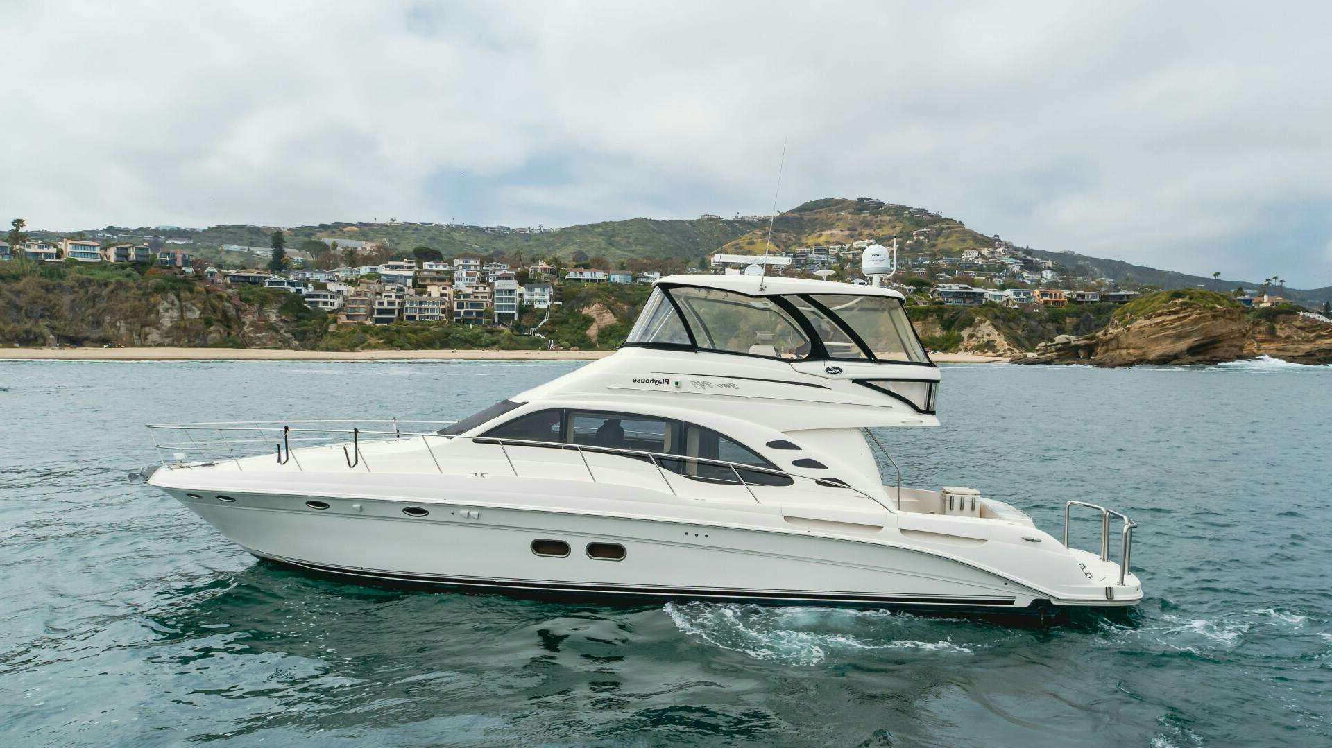 a white yacht in the water aboard PLAYHOUSE Yacht for Sale