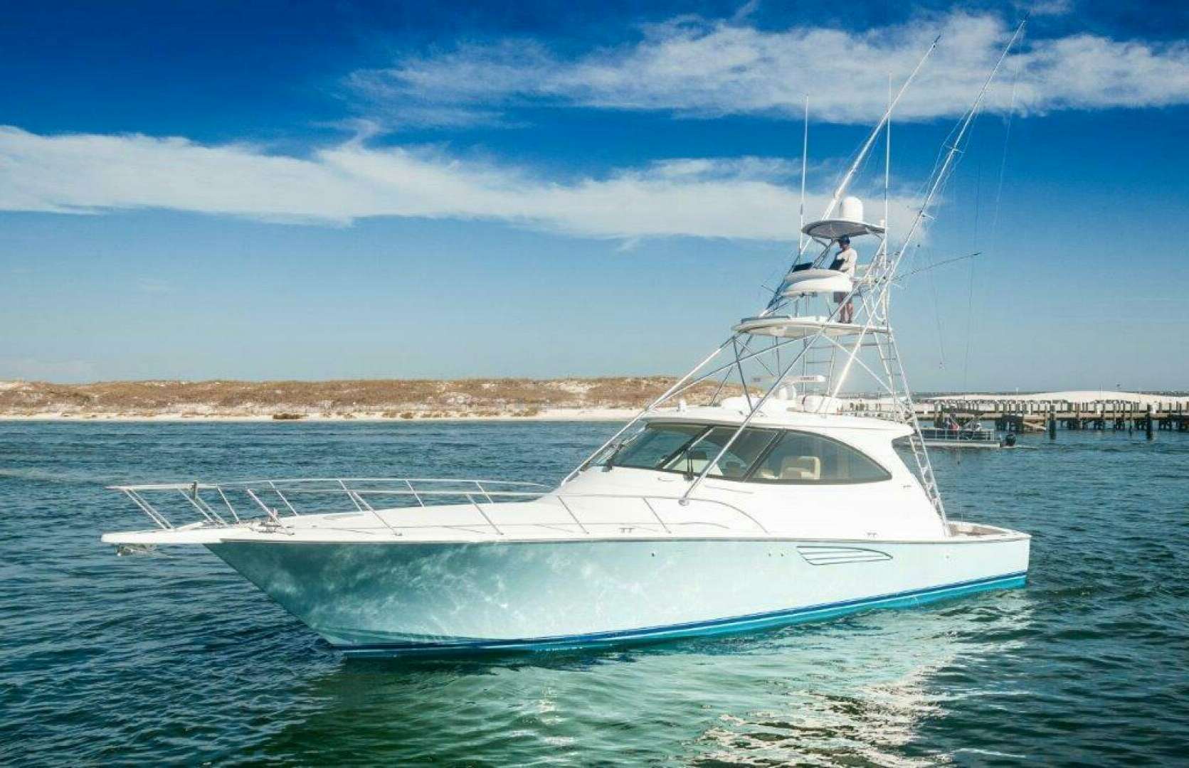 a white boat on the water aboard BIG DADDY'S Yacht for Sale