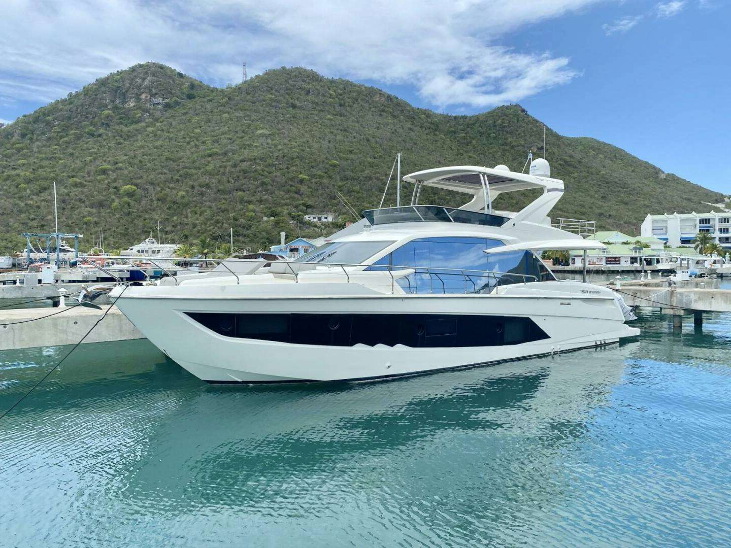 a boat docked at a pier aboard SUNSHINE Yacht for Sale