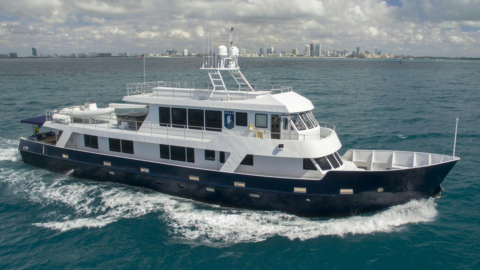 a large white boat on the water aboard KAHU Yacht for Sale