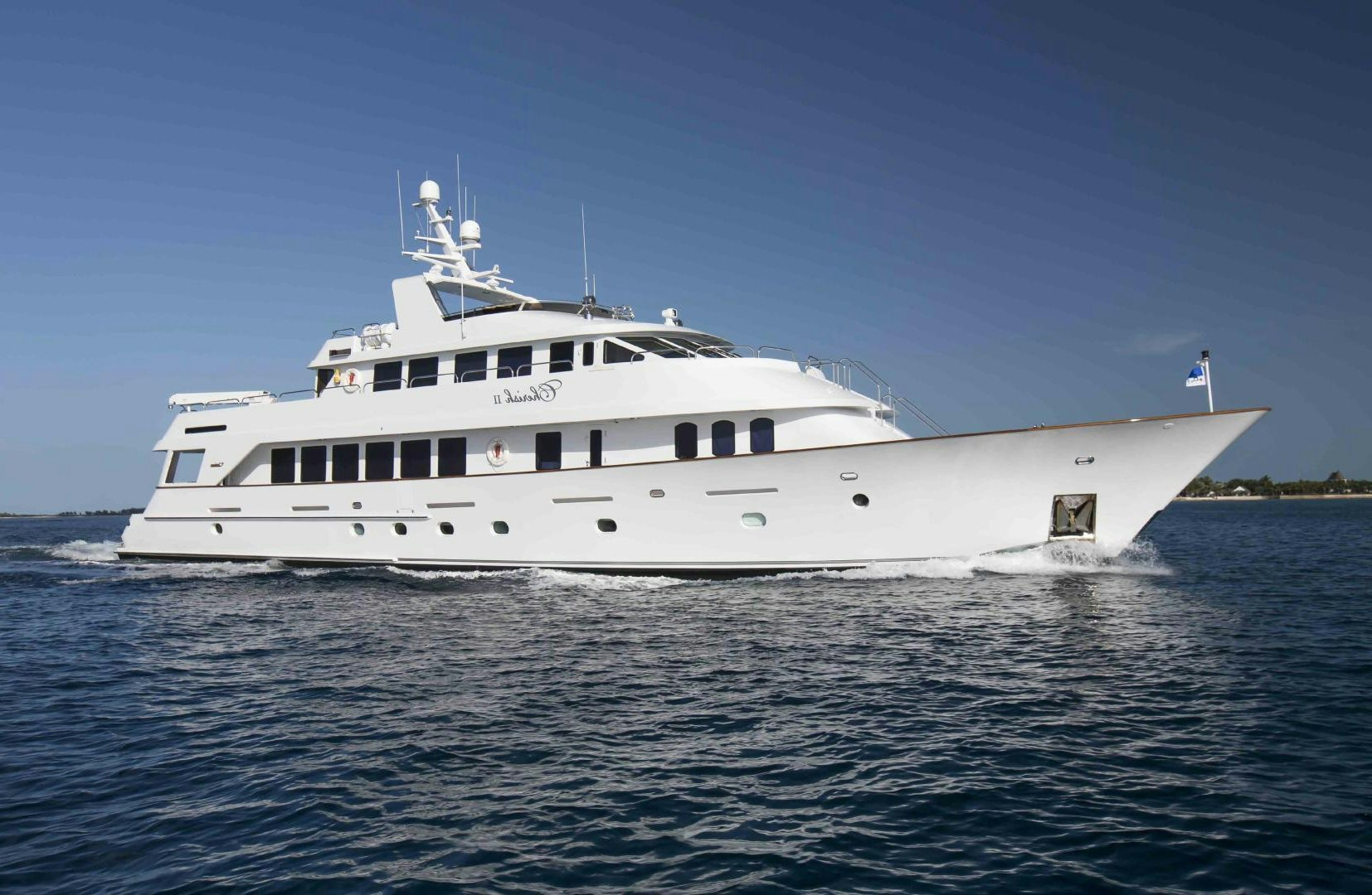 a large white boat in the water aboard CHERISH Yacht for Sale