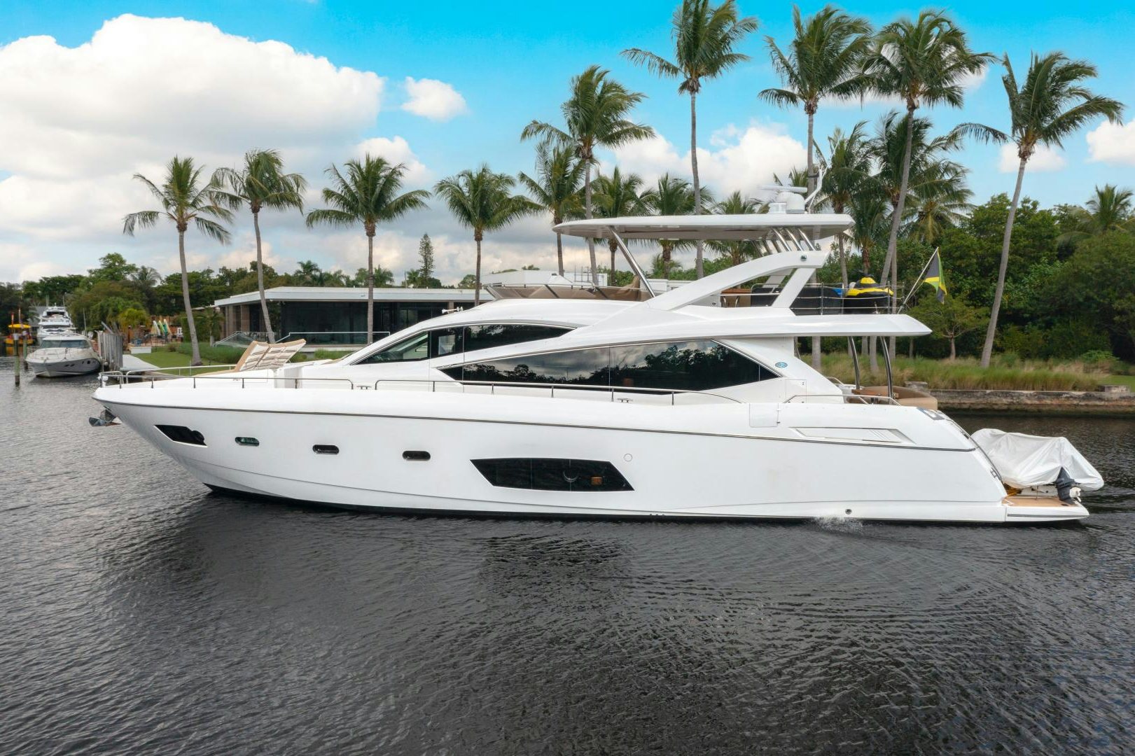 a white yacht on a beach aboard SOL Y LUNA Yacht for Sale