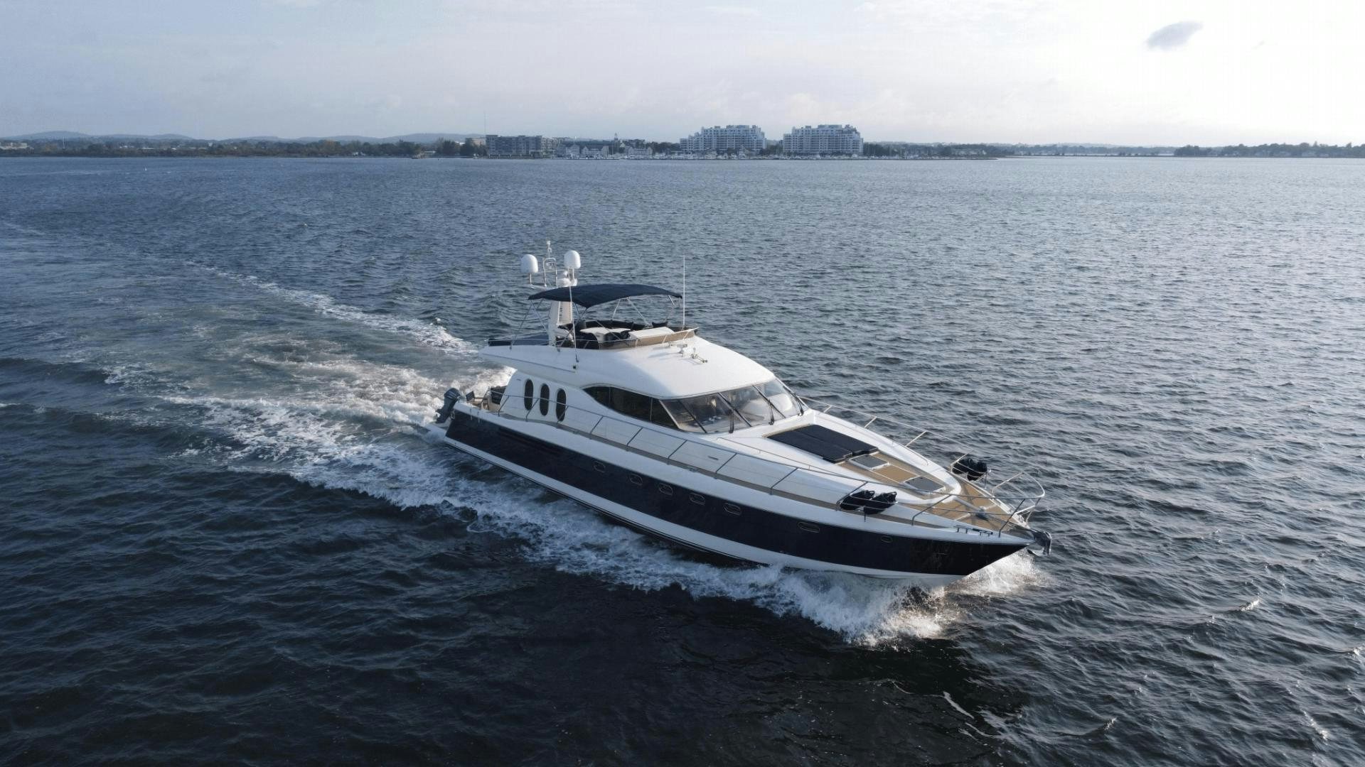 a white yacht in the water aboard JOIE DU ROI Yacht for Sale