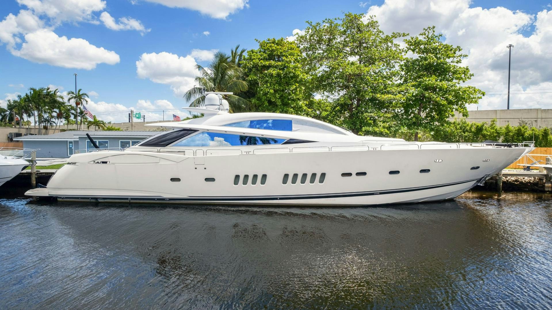 a white yacht docked at a dock aboard DIABLO BLANCO Yacht for Sale