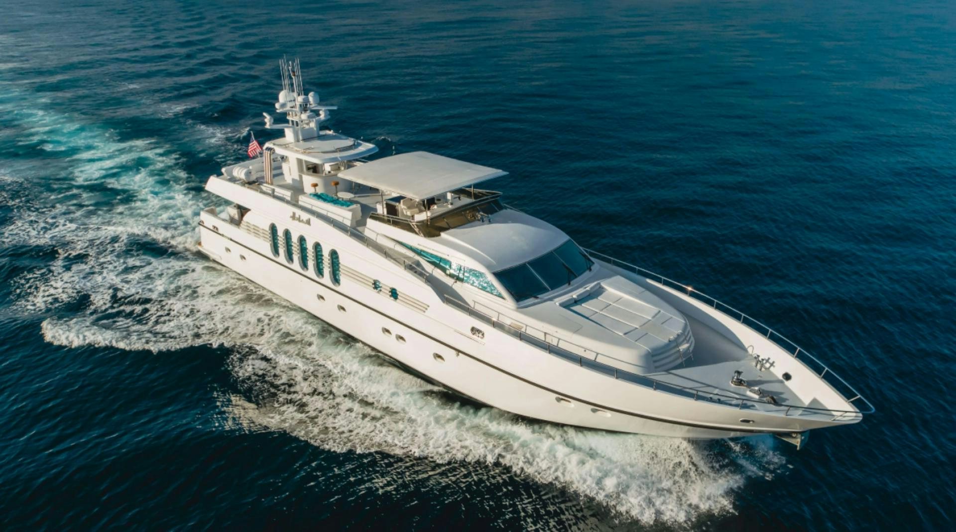 a white yacht on the water aboard MARBELLA Yacht for Sale