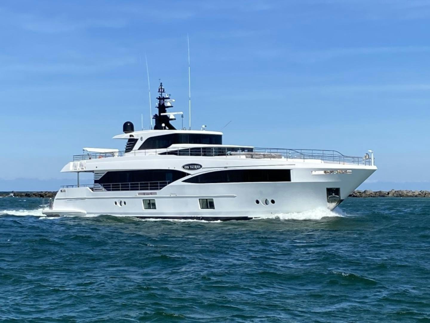 a white boat in the water aboard KRISHH Yacht for Sale