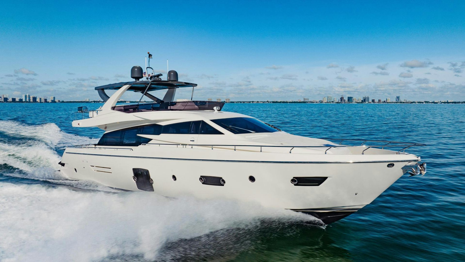 a white yacht on the water aboard SAMI KAY III Yacht for Sale