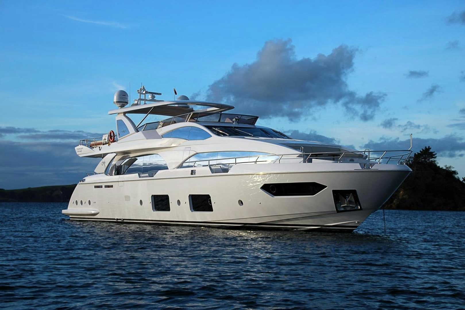 a white yacht on the water aboard LA TACHE Yacht for Sale