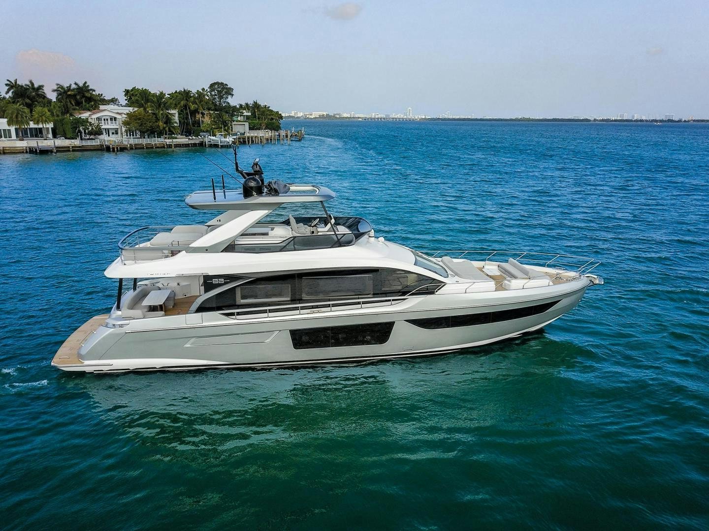 a white boat in the water aboard CRIMSON Yacht for Sale