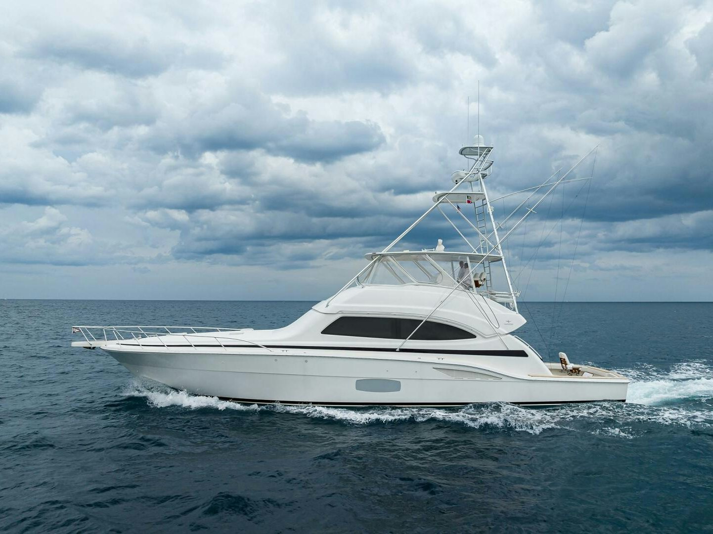 a white boat in the water aboard GOIN DEEP Yacht for Sale