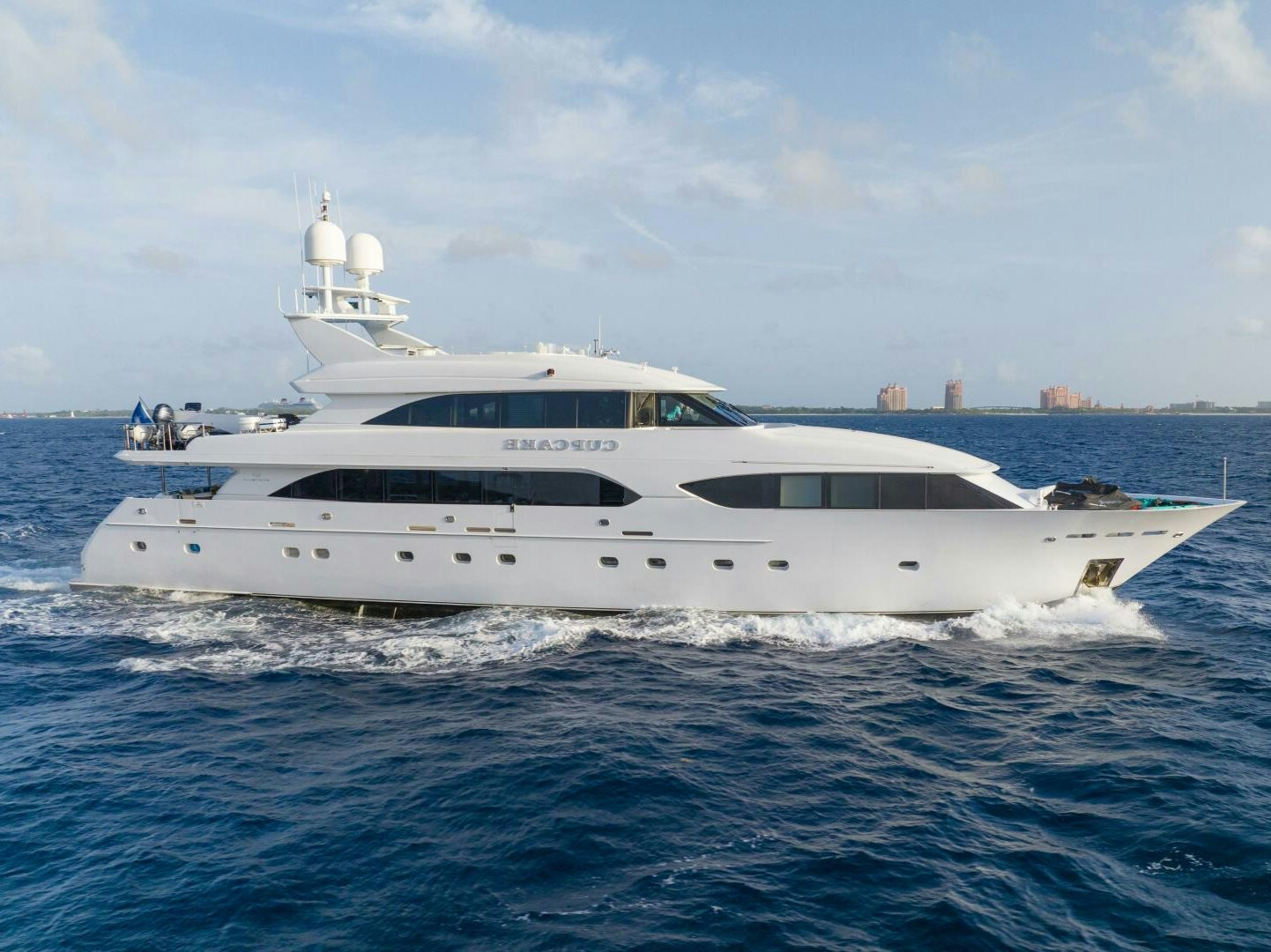 a white yacht in the water aboard CUPCAKE Yacht for Sale