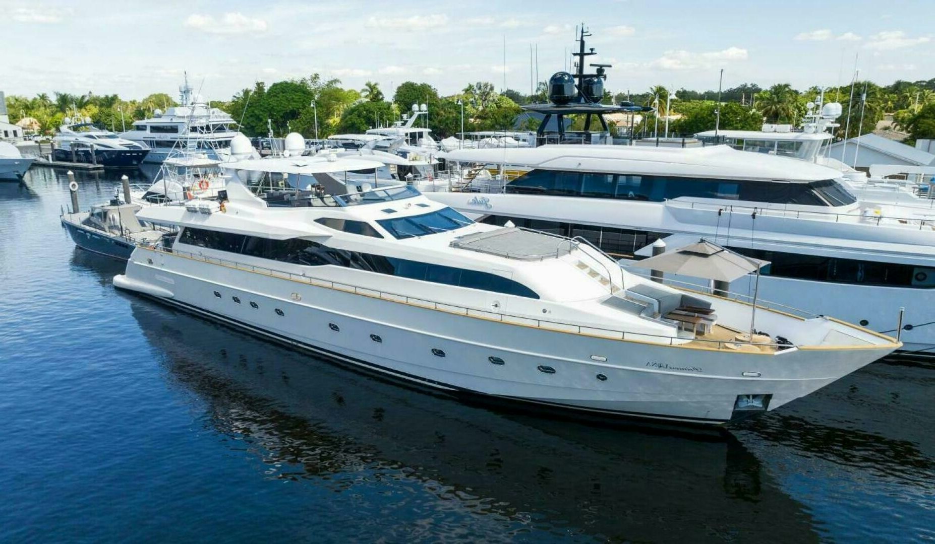 a large white boat in a harbor aboard PRINCESS LONA Yacht for Sale